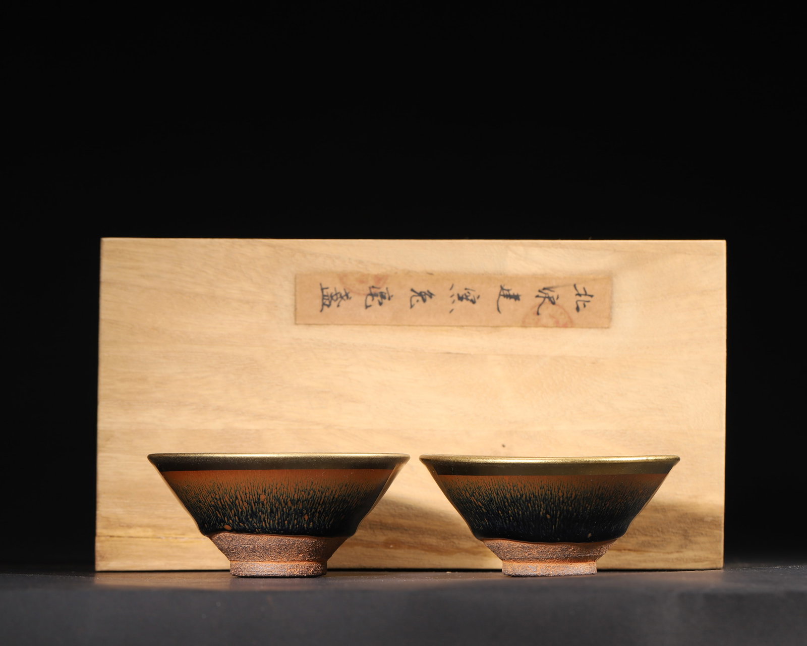 SONG DYNASTY, JIANYAO HARE'S FUR GLAZED GILDED RIM DOULI TEA BOWLS (PAIR): D 3.88" x H 1.75" (D 10.0cm x H 4.5cm)A fine pair of Song Dynasty Jianyao tea bowls, featuring classic hare's fur glaze patterns and gilded rims. They embody the pinnacle of Song Dynasty tea culture a