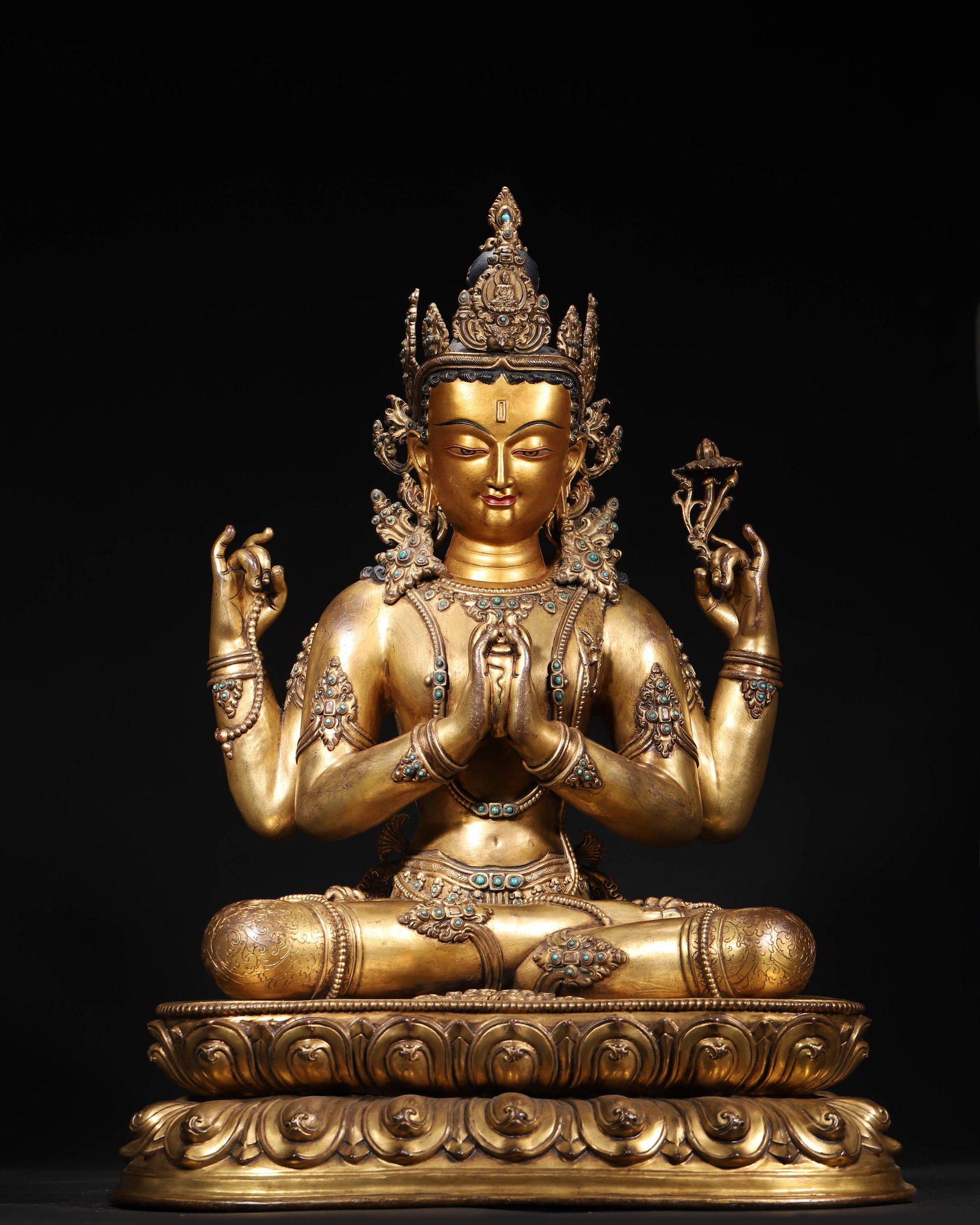 GILT-BRONZE INLAID FOUR-ARM GUANYIN, QIANLONG PERIOD, QING DYNASTY: 17.72" x 13.39" x 24.02" inches (45.0 cm x 34.0 cm x 61.0 cm) (Main) | Weight: 47.4 lbs (21500.0 g)An gilt-bronze statue of Four-Arm Avalokiteshvara, made in the Qianlong period. With inlaid gems and