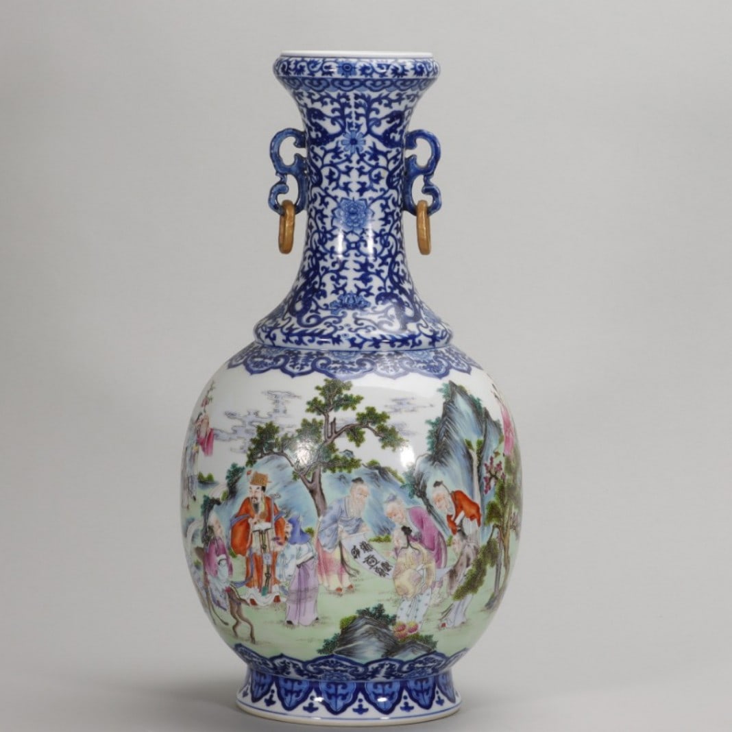QING DYNASTY QIANLONG PERIOD, BLUE-AND-WHITE AND FAMILLE ROSE DOUBLE-EAR VASE WITH "IMMORTALS: H: 16.26" (H:41.3cm)A magnificent Qianlong period vase, with blue and white neck and famille red 'Immortals' scene. A masterpiece of official kiln craftsmanship, embodying the peak of Qing Dynasty por