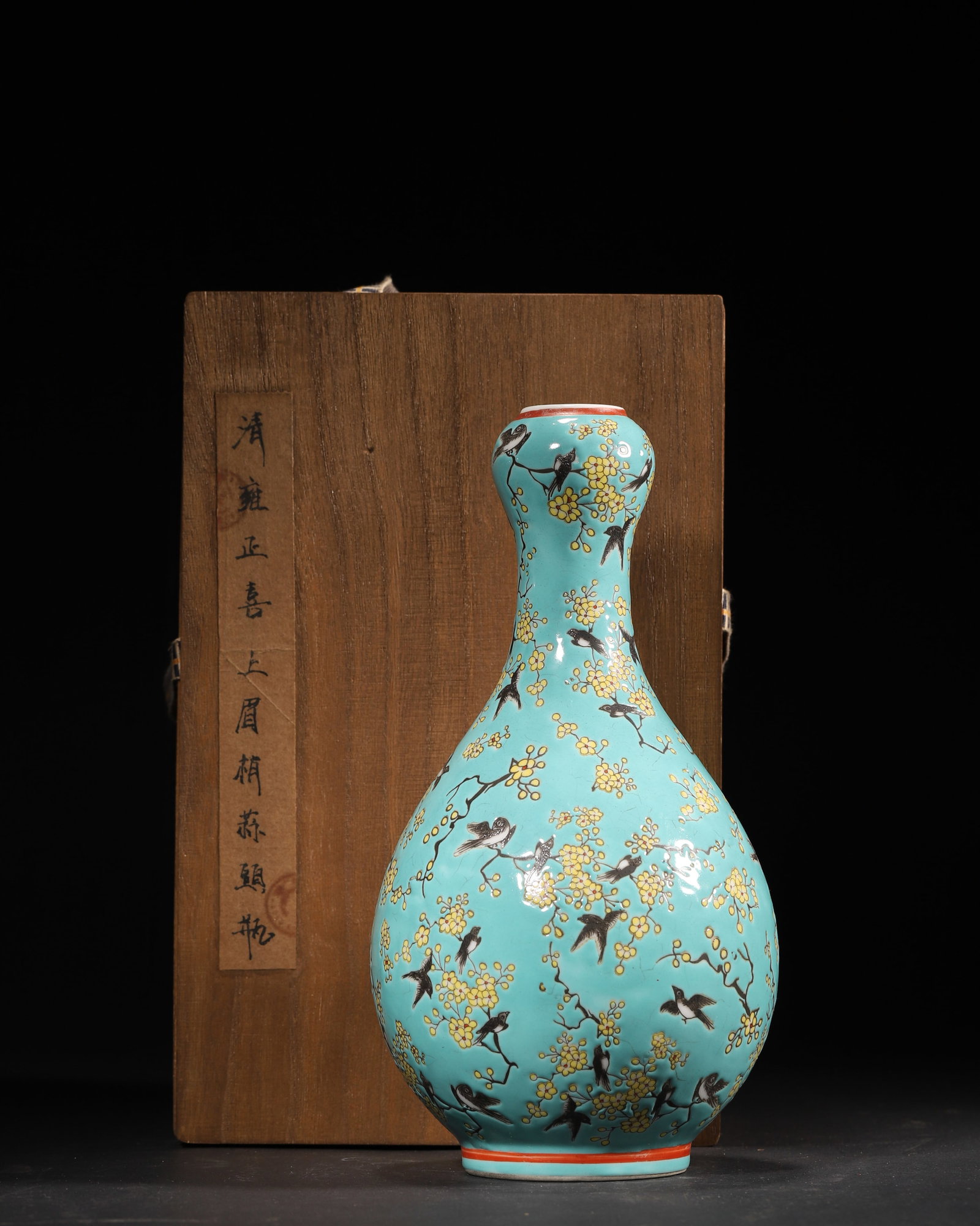 QING DYNASTY, YONGZHENG PERIOD, TURQUOISE-GROUND INK-COLORED GARLIC-HEAD VASE WITH MAGPIES AND PLUM: D 4.75" x H 9.50" (D 12.0cm x H 24.0cm)An official kiln masterpiece from the Yongzheng period of the Qing Dynasty. The garlic-head vase features a regular form, a delicate turquoise ground, and auspic