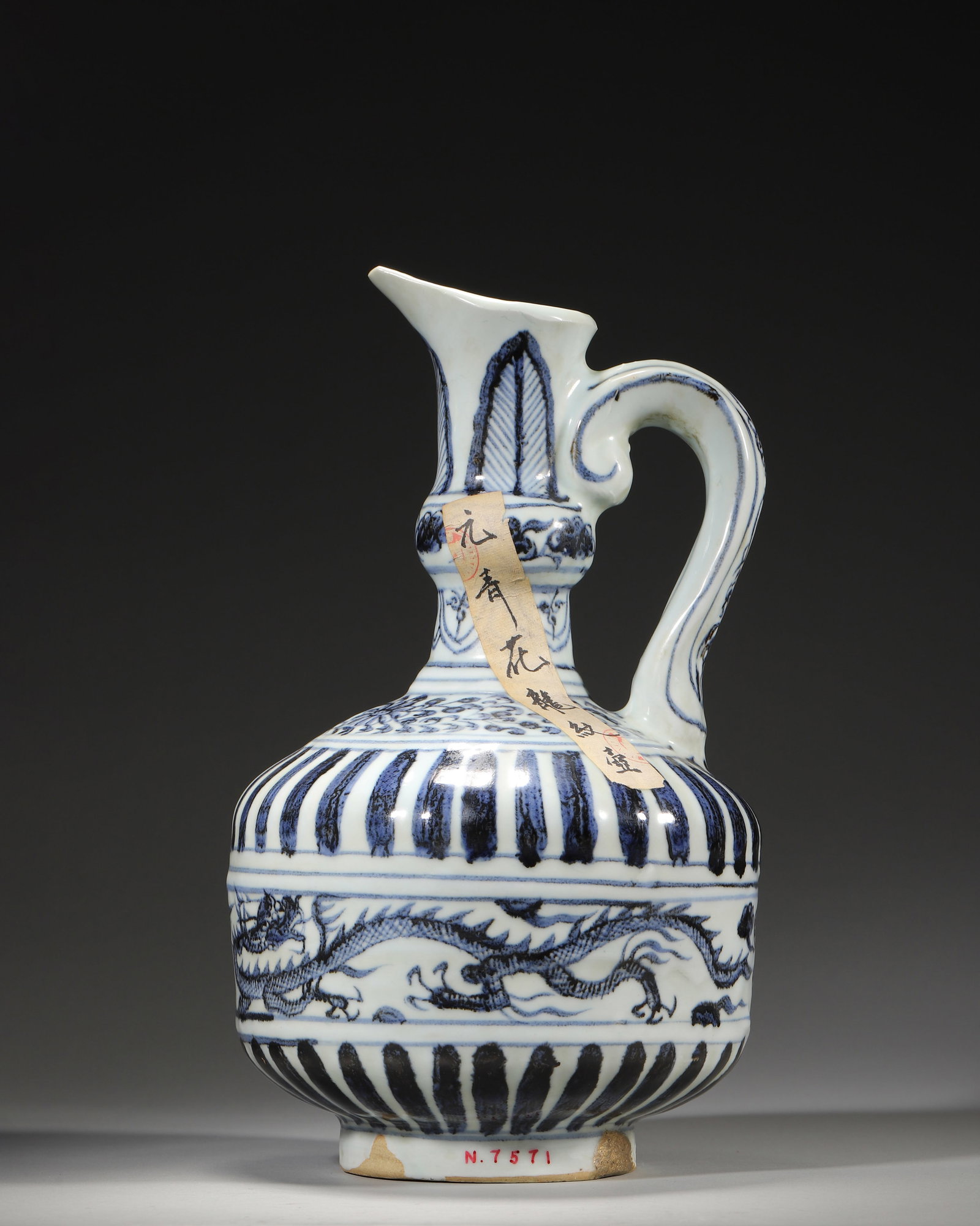 YUAN DYNASTY BLUE AND WHITE 'DRAGON AND CLOUD' EWER: 6.69" x 11.42" inches (17.0 cm x 29.0 cm)A rare Yuan Dynasty blue and white ewer, featuring a lustrous glaze, vibrant cobalt-blue dragon-and-cloud motifs, and a form blending Central Asian and