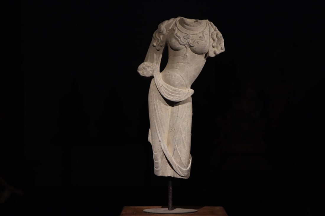 A FINE GREY STONE TORSO OF A STANDING BODHISATTVA, HIGH TANG DYNASTY, 7TH–8TH CENTURY AD: Height: 27.56" inches (70.0 cm)The carving features smooth, exquisite lines and a graceful posture, retaining its profound spiritual charm and boasting a uniquely distinctive artistic style. It is