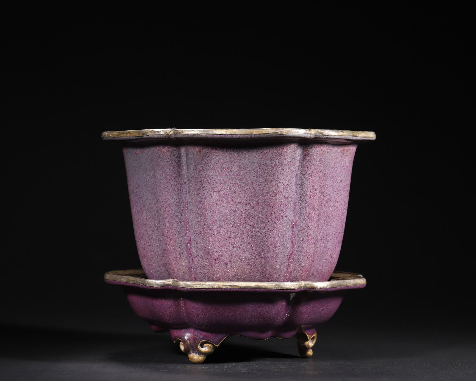 A FINE NORTHERN SONG DYNASTY (10TH–12TH CENTURY) JUNYAO ROSE-PURPLE GLAZED SUNFLOWER-FORM PLANTER: 9.84" x 7.87" inches (25.0 cm x 20.0 cm) (Main)This exquisite Northern Song Junyao planter features a lustrous rose-purple glaze and sunflower-shaped form. Later fitted with Qing Dynasty silver-gilt m