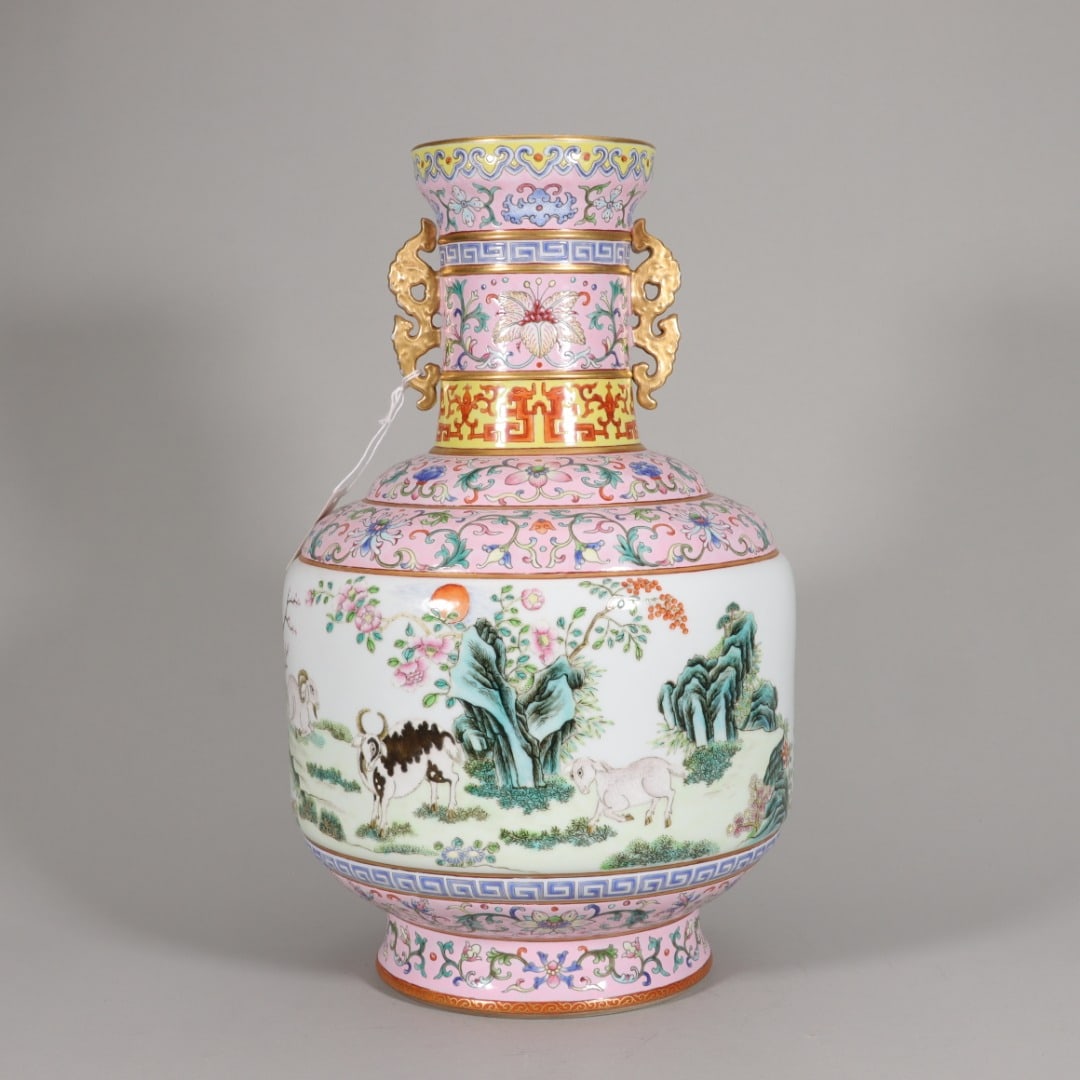 QING DYNASTY QIANLONG PERIOD, PALACE PINK-GROUND FAMILLE ROSE DOUBLE-EAR ZUN WITH "THREE YANGS BRING: H: 13.31" (H:33.8cm)A fine Qianlong period official kiln vase, with famille rose 'Three Rams' scene. A masterpiece of Qing Dynasty porcelain art, embodying the peak of craftsmanship and imperial elega