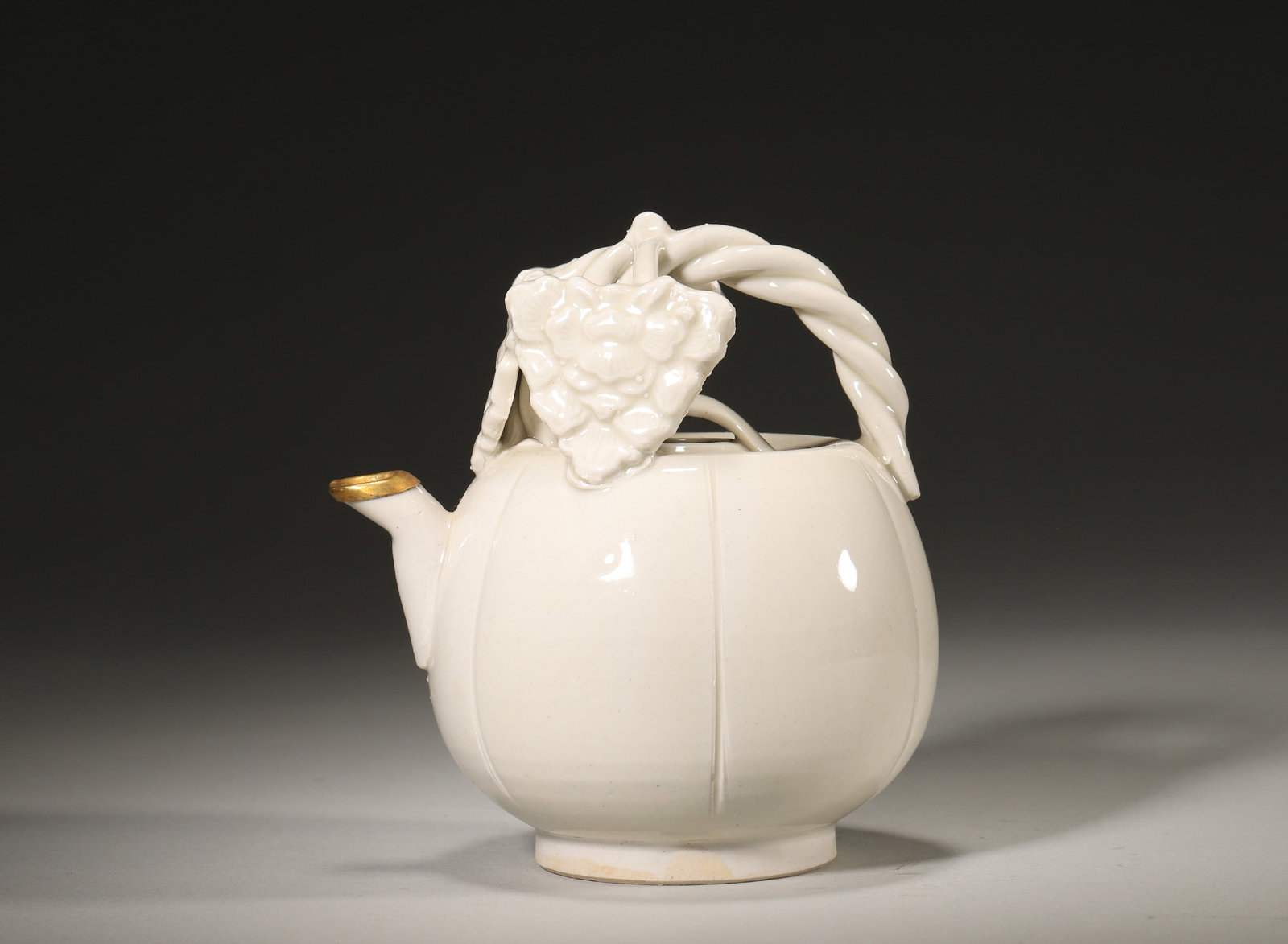 A NORTHERN SONG DYNASTY DINGYAO WHITE-GLAZED MELON-SHAPED EWER (1 of 5)