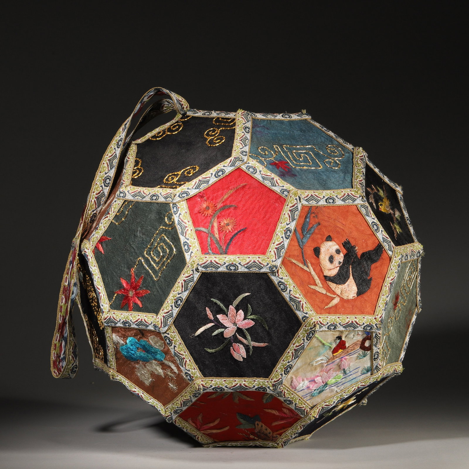 An Embroidered Silk Ball with Flowers, Birds and Panda Motifs, Qing Dynasty: D 30.0cm (11.81 in); Wt 276.0g (0.61 lb)This ball is stitched from multi-colored silk panels with brocade trims. Each panel features fine embroidery of pandas, flowers, birds and landscapes in vivid h