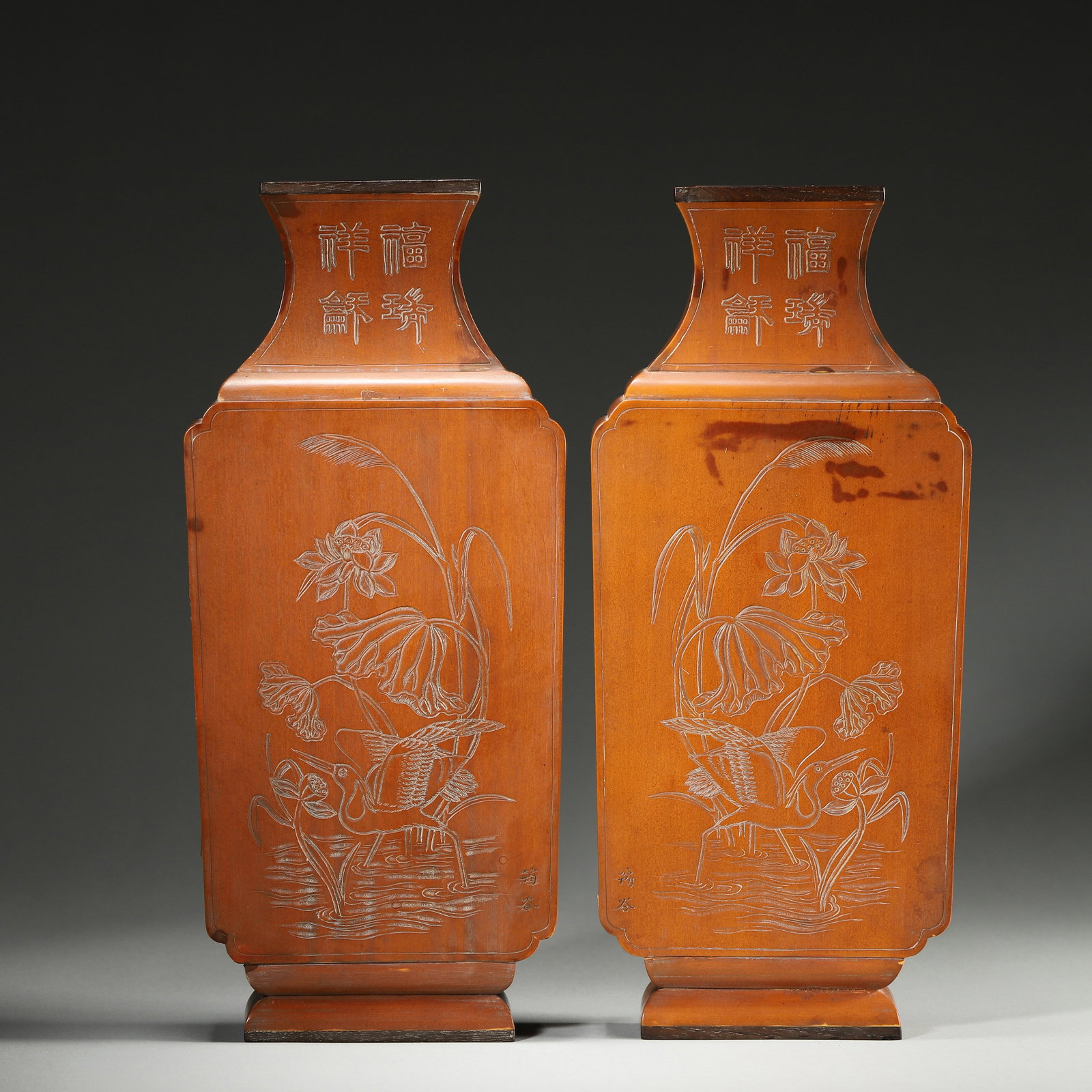 A Pair of Bamboo Veneer Carved Wall Vases with Egret and Lotus and Inscriptions, Qing Dynasty: L 11.0cm (4.33 in); W 3.0cm (1.18 in); H 26.0cm (10.24 in); Wt 666.0g (1.47 lb)A pair of Qing Dynasty bamboo veneer wall vases, with red wood accents and hanging holes. Carved with "Egret and Lotus" m