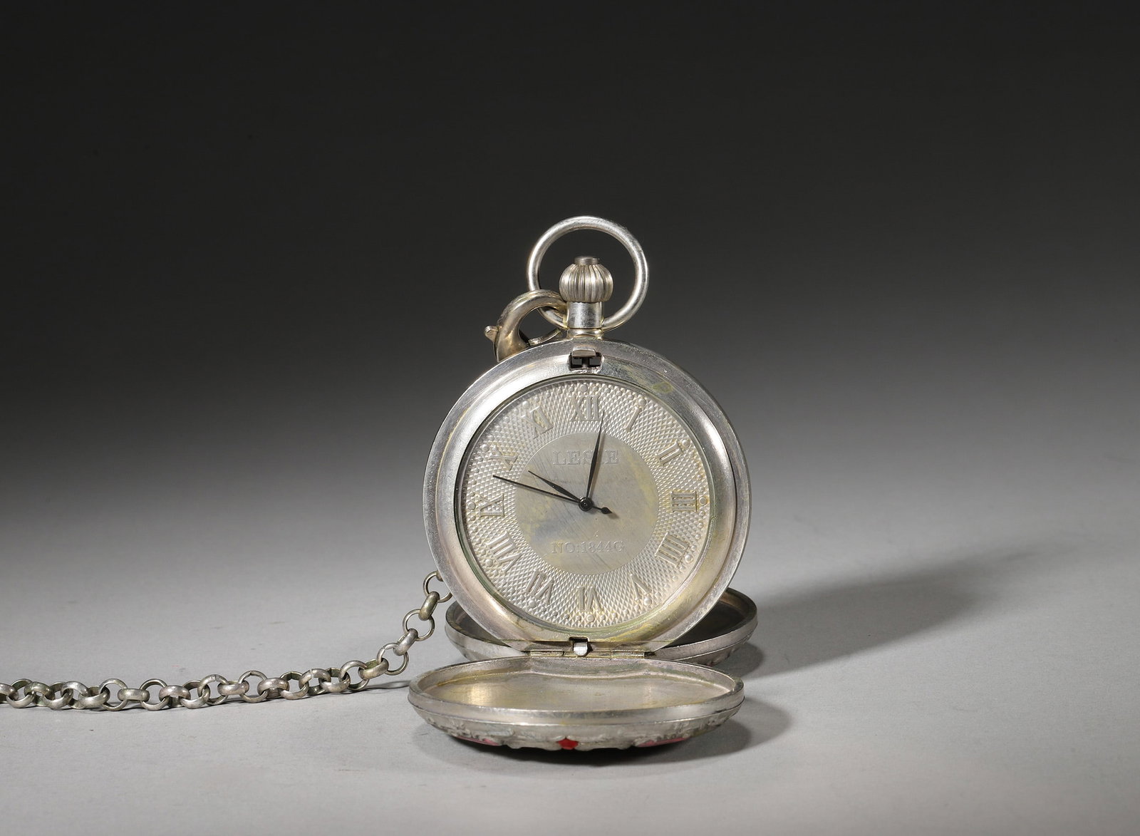 EARLY 20TH CENTURY SWISS COPPER-SILVER GILT ENAMEL 8-DAY POCKET WATCH WITH WESTERN FIGURE SCENE: Diameter: 5.5cm (2.17in) Weight: 181g (0.40lb)A fine early 20th century Swiss 8-day hunter-case pocket watch, copper-silver gilt with enamel and gem-like inlays, carved with Western figures, original 