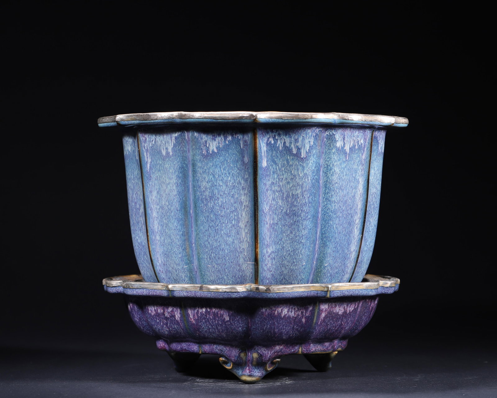 CHINESE JUN KILN ROSE-PURPLE GLAZED CHRYSANTHEMUM-FORM PLANTER AND STAND (WITH QIXIANG PALACE: 9.84in x 8.66in (25.0cm x 22.0cm)This Northern Song Jun kiln planter and stand features striking rose-purple glaze, elegant chrysanthemum form, and gilt-silver mounted rim with Qixiang Palace inscript