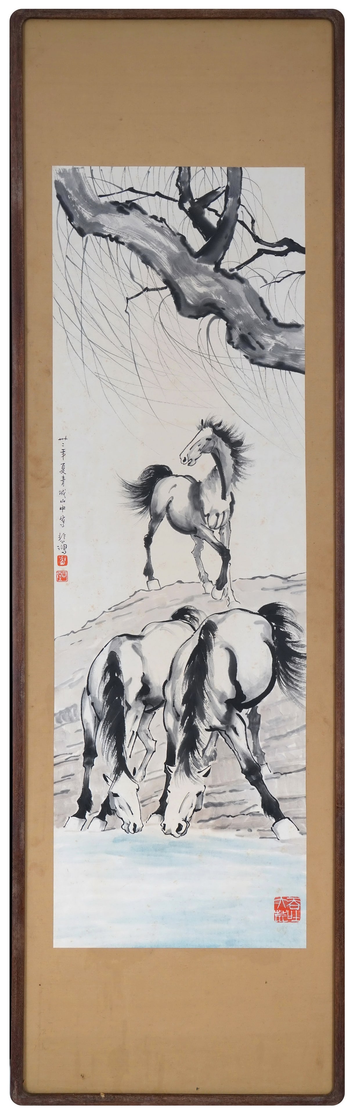THREE HORSES UNDER WILLOW, INK WASH PAINTING BY XU BEIHONG, 1943, FRAMED: 47.64 x 14.96 in (121 x 38 cm)A 1943 masterpiece by Xu Beihong. Three horses rest under willow, rendered with dynamic ink. Inscribed, sealed, and in original frame, a fine example of his equine art.