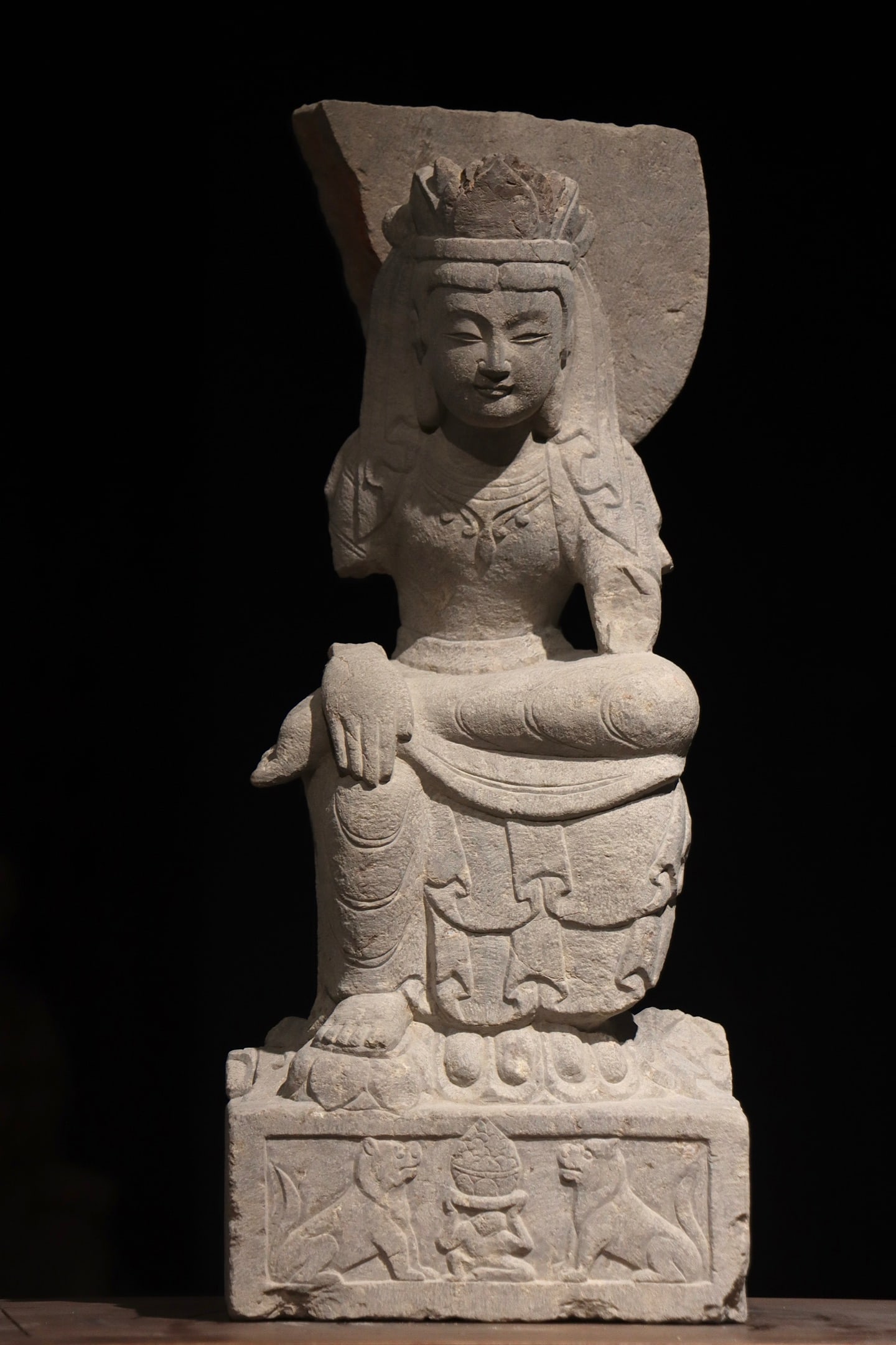 A CARVED STONE FIGURE OF A THINKING BODHISATTVA, NORTHERN WEI DYNASTY, 5TH-6TH CENTURY: Height: 22.83in (58.0cm)Carved from bluestone, this Northern Wei Thinking Bodhisattva sits in contemplation with a serene expression, embodying the iconic "slender, elegant" style. Its intact beast-de
