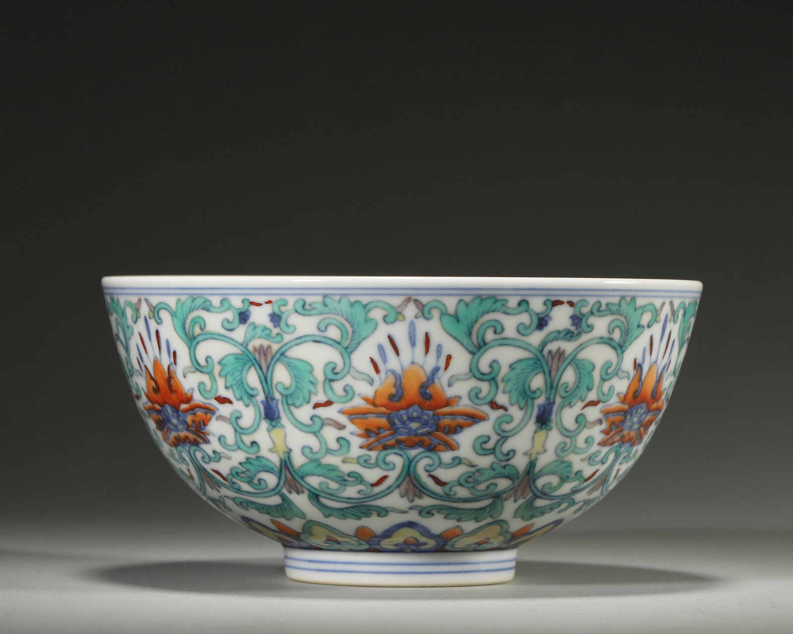 A DOUCAI BOWL WITH INTERLOCKING LOTUS, YONGZHENG PERIOD, QING DYNASTY: D: 14cm (5.51in) H: 7cm (2.76in)A superb Yongzheng period imperial doucai bowl, interlocking lotus design, exquisite craftsmanship, imperial mark, high collection value.
