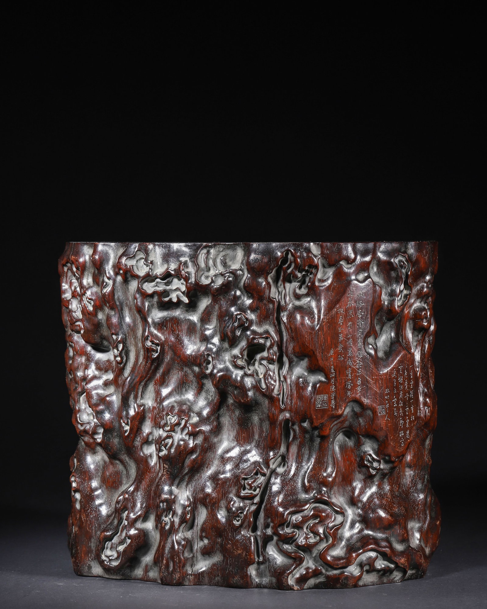 TONGZHI PERIOD, QING DYNASTY, A ZITAN BRUSH POT CARVED IN NATURAL TREE ROOT FORM, INSCRIBED BY CHEN: 11.02" x 9.06" x 9.45" (28.0cm x 23.0cm x 24.0cm) 13.413lb (6084g)Carved from a single piece of zitan wood, this brush pot mimics natural tree root texture. It is adorned with inlaid silver inscriptio