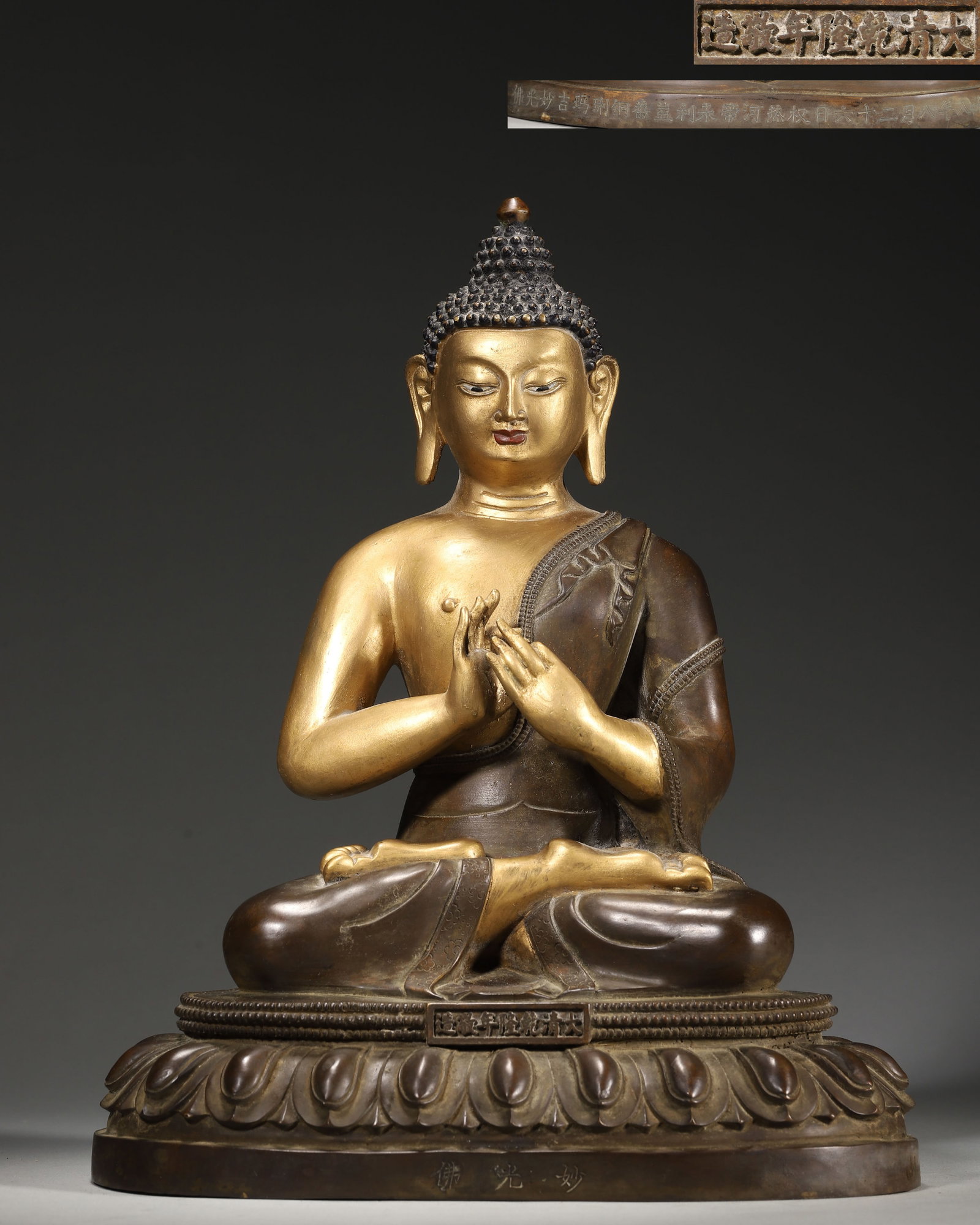 IMPERIAL QIANLONG PERIOD, QING DYNASTY GILT-BRONZE SEATED STATUE OF BUDDHA SA?TYAKTAPRABHA (WITH: 9.06" x 6.3" x 11.42" (23cm x 16cm x 29cm) 9.81lb (4451g)An imperial Qianlong-period gilt-bronze seated Buddha Sa?tyaktaprabha, with a serene expression and Dharmachakra mudra. Bearing dated Qianlong 