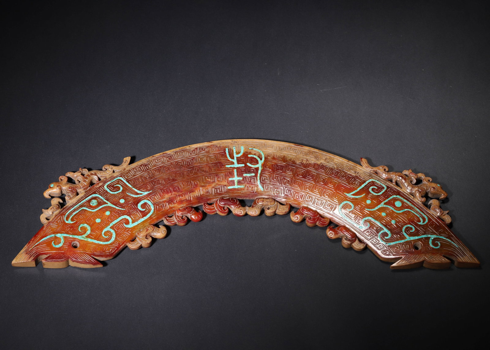 HAN DYNASTY HETIAN JADE HUANG PENDANT WITH CINNABAR PATINA, TURQUOISE INLAY AND DRAGON-PHOENIX: 15.75" x 4.72" (40cm x 12cm) 1.96lb (889g)Carved from Hetian jade, this Han Dynasty Huang pendant features rich cinnabar patina, turquoise inlay, and intricate dragon-phoenix carvings. It embodies anc