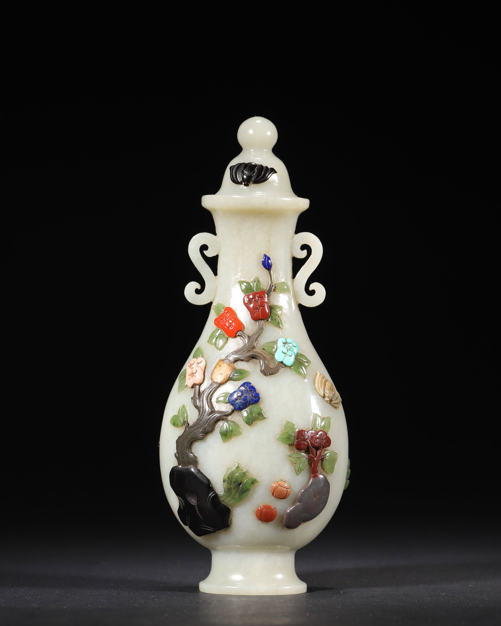 A FINE IMPERIAL WHITE JADE INLAID GEMSTONE 'LONGEVITY AND BLESSING' VASE AND COVER, QIANLONG PERIOD,: 2.76in x 1.97in x 7.09in (7.0cm x 5.0cm x 18.0cm), 0.743lb (337.0g)This exquisite imperial vase, crafted from fine white jade during the Qianlong period, features intricate gemstone inlay of peaches, 
