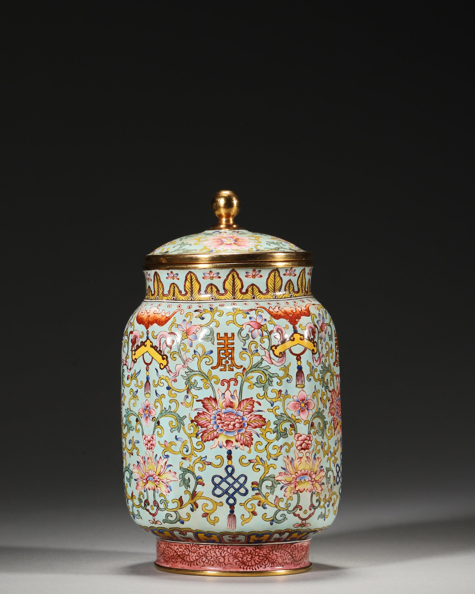QIANLONG PERIOD, QING DYNASTY COPPER-BODIED ENAMEL LOBED JAR WITH LONGEVITY AND FLORAL MOTIFS: 2.76in (7.0cm), 0.88lb (399.0g)A fine Qianlong period copper enamel lobed jar with pale turquoise ground, vibrant floral and longevity motifs, and gilt rims. Marked "Qianlong Nian Zhi", it exemplifies