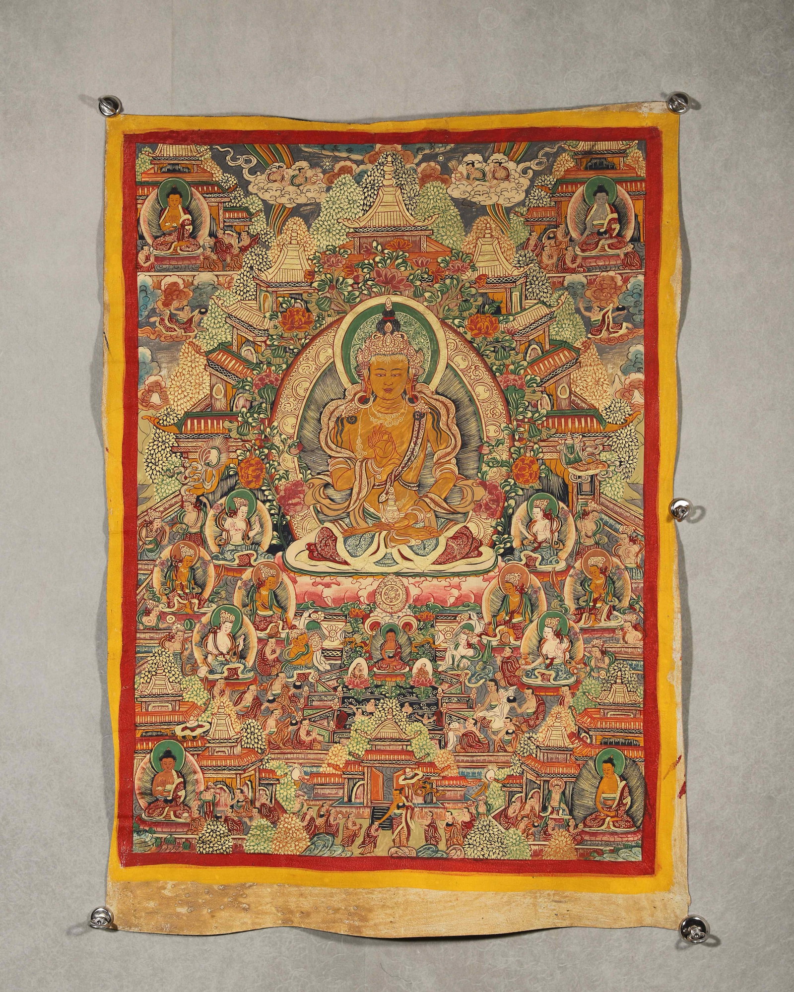 TIBETAN BUDDHIST THANGKA OF MAITREYA’S PURE LAND WITH TIBETAN INSCRIPTIONS, 19TH CENTURY: 33.86in x 25.20in (86.0cm x 64.0cm)This 19th-century Tibetan Thangka depicts Maitreya Buddha in his pure land, crafted with vivid mineral pigments and gilded details. Tibetan inscriptions on the rever