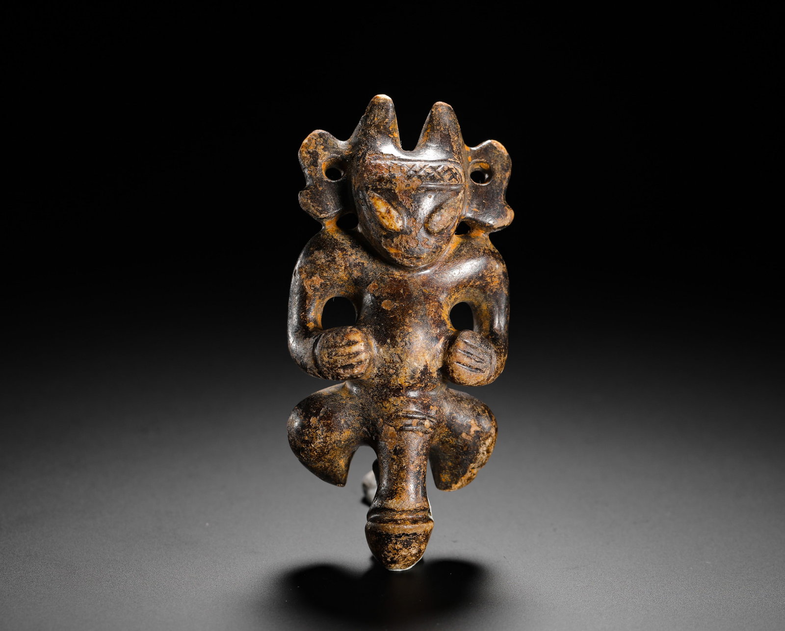 Jade God Figure, Red Mountain Culture, Northeast China: This Jade god like figurine is a classic artifact of the Red Mountain (Hong shan) Culture of northeast China. Crafted from solid jade, age has developed a deep brown patina. The unique form reflects t
