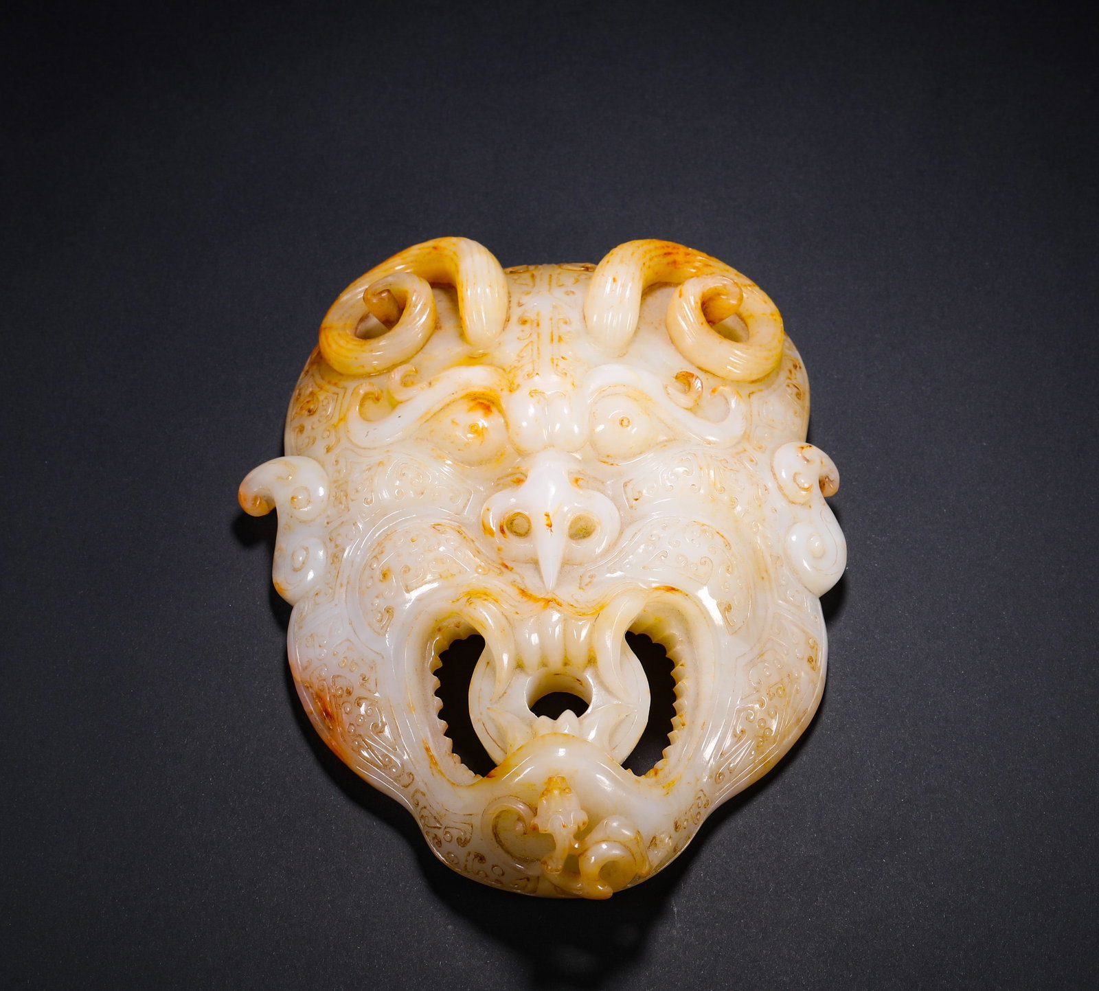 White Hetian Jade Pendant, Auspicious Beast, Han Dynasty: H:18.6cm(7.32in) W:14.3cm(5.63in) Weight:958g(2.11lb)This pendant is a masterpiece of Han Dynasty ancient jade craftsmanship. Carved from top-quality Hetian white jade, it features a high-relief taoti