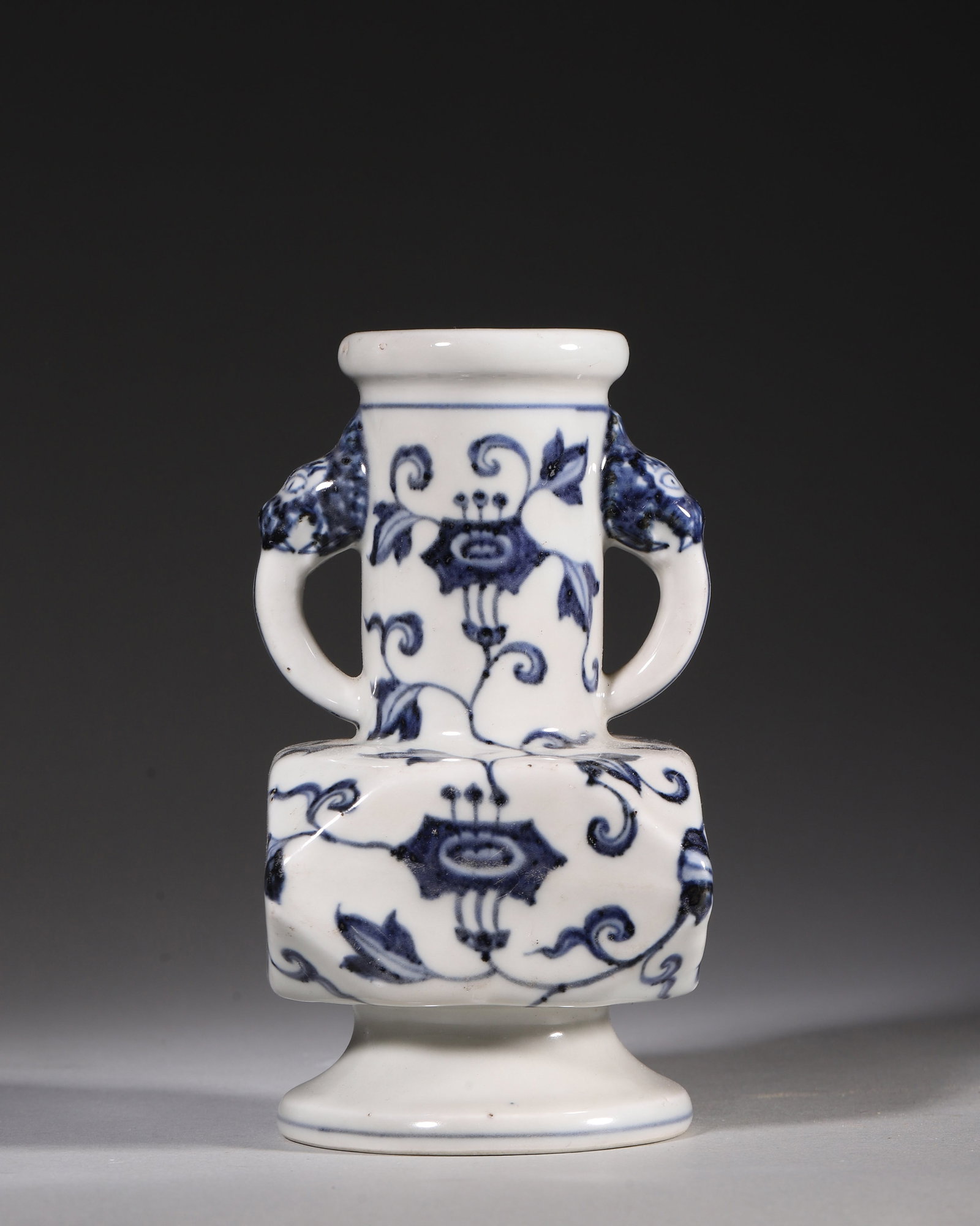 Blue and White Porcelain Square Vase with Animal Handles, Xuande Period, Ming Dynasty: Exquisite miniature blue and white porcelain square vase from the Xuande period of the Ming Dynasty. Features a straight neck, animal mask ring handles and flared foot, painted with underglaze blue wi
