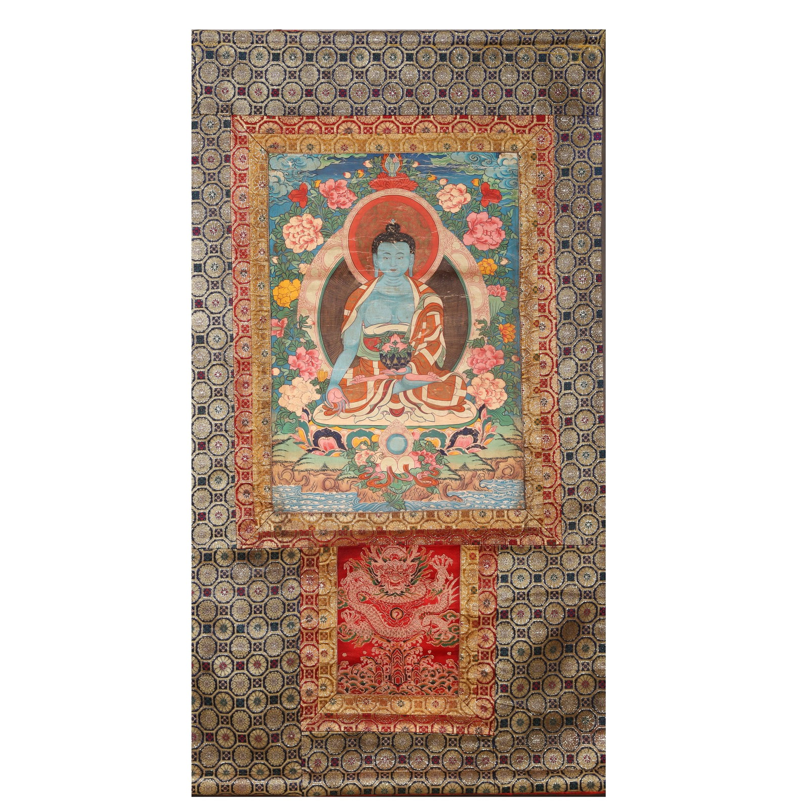 Tibetan Mineral Pigment Thangka of Medicine Buddha with Original Brocade Mount, Late Qing Dynasty: A Tibetan devotional thangka of Medicine Buddha, Late Qing dynasty, painted with mineral pigments on textile and presented in its original brocade mount. The central figure of Medicine Buddha is depic