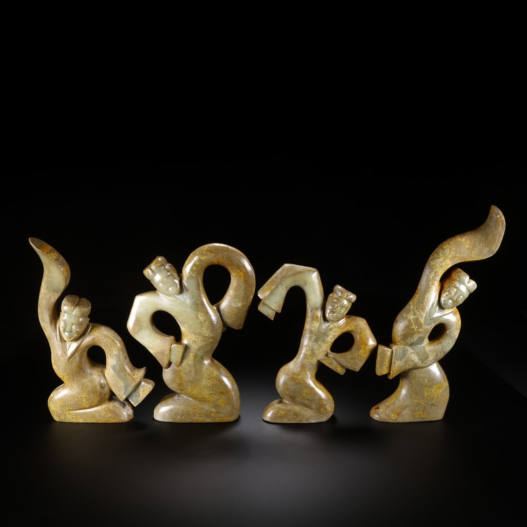 A SET OF FOUR PIECES OF HAN HETIAN JADE DANCERS (1 of 9)
