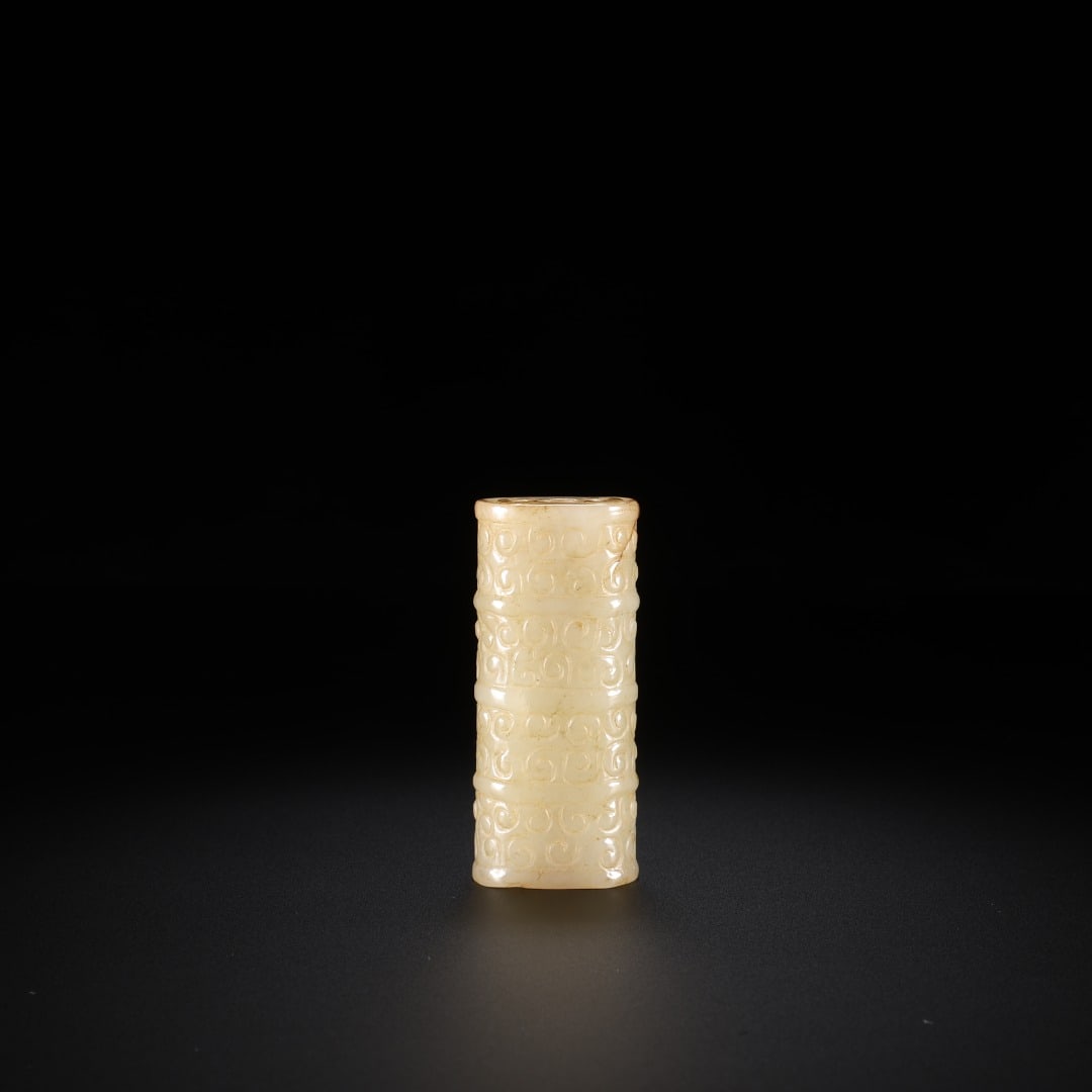 HAN DYNASTY HETIAN JADE CLOUD-PATTERNED PENDANT: Ancient jade tube pendant with grain patterns. Made of Hetian jade with light yellow patina. The hollow cylindrical lezi is divided by string lines, fully carved with orderly grain motifs. Grain patte