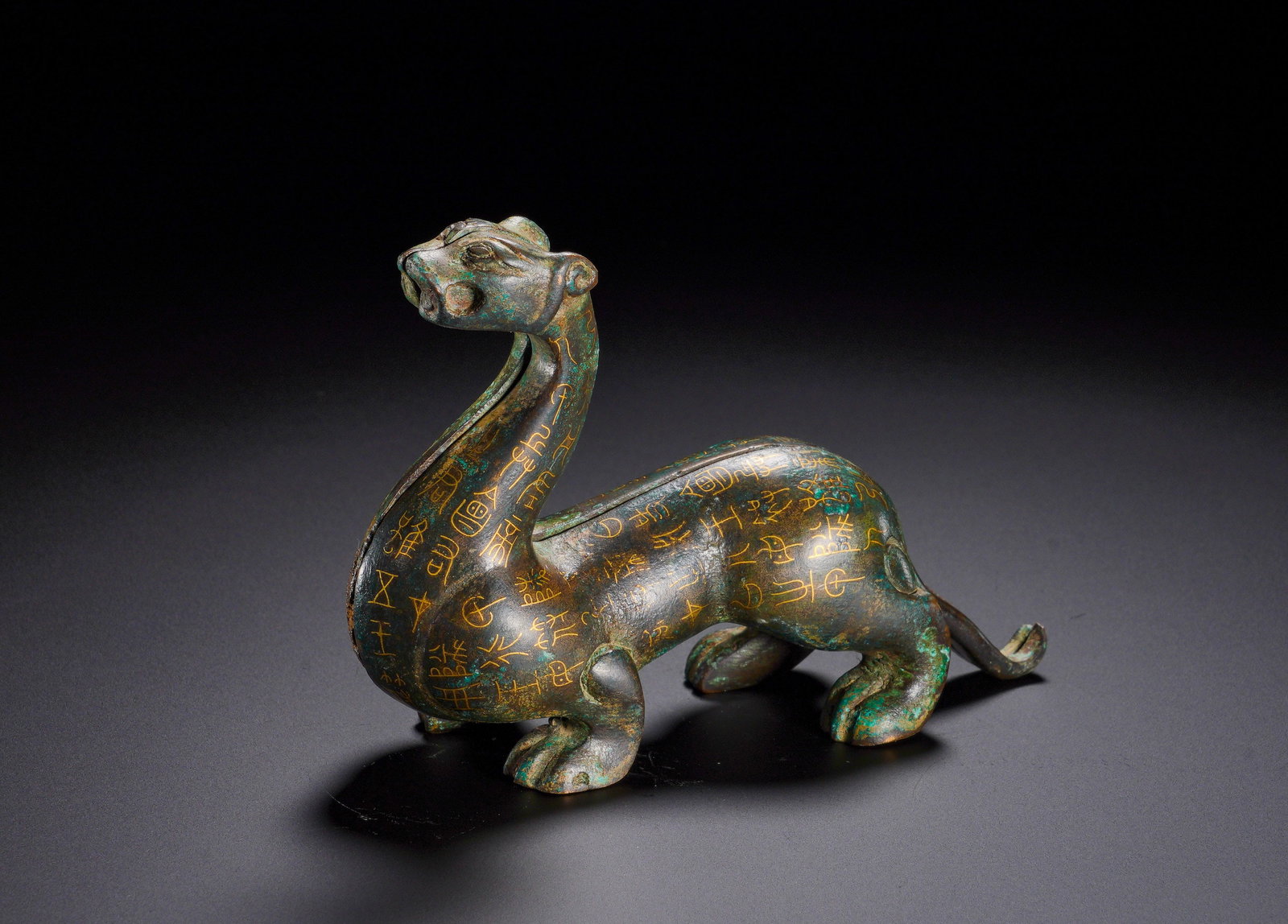 WARRING STATES PERIOD, GOLD-INLAID BRONZE BEAST-FORM MILITARY TALLY