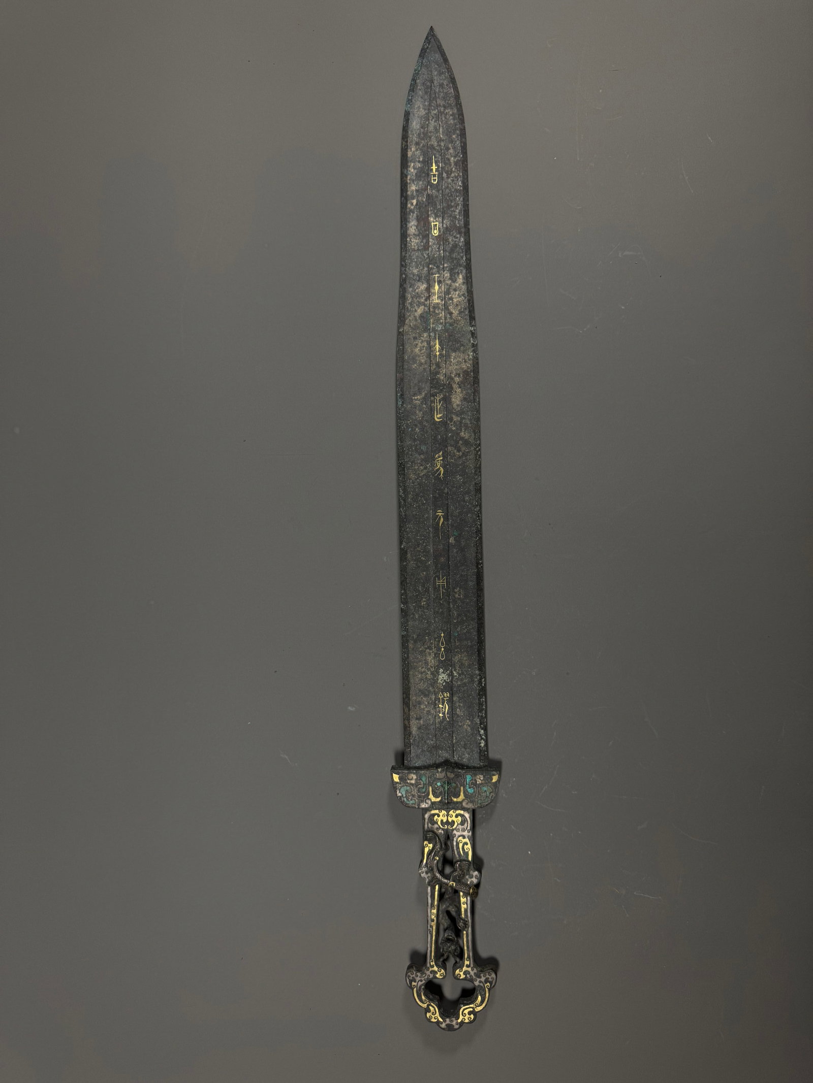 WARRING STATES PERIOD, BRONZE SWORD WITH GOLD INSCRIPTIONS AND HOLLOWED-OUT DRAGON PATTERNS (1 of 13)