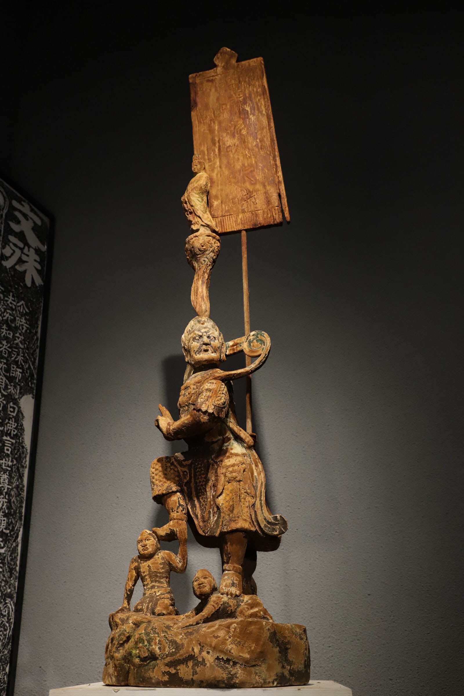 MING DYNASTY, PAINTED WOOD GUARDIAN GENERAL FIGURE: Representative folk woodcarving style of Central Plains in the Ming Dynasty, distinguished by unique layered three-dimensional carving craft. The sculpture features rugged powerful shapes, concise for