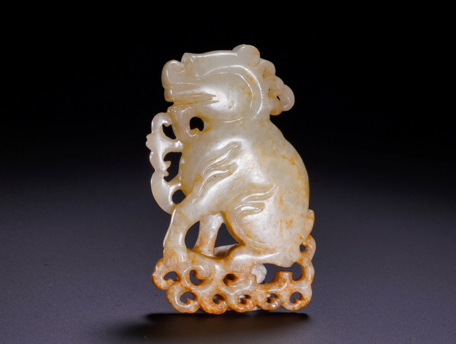 QING DYNASTY HETIAN JADE HOLLOWED-OUT AUSPICIOUS BEAST PENDANT (1 of 6)