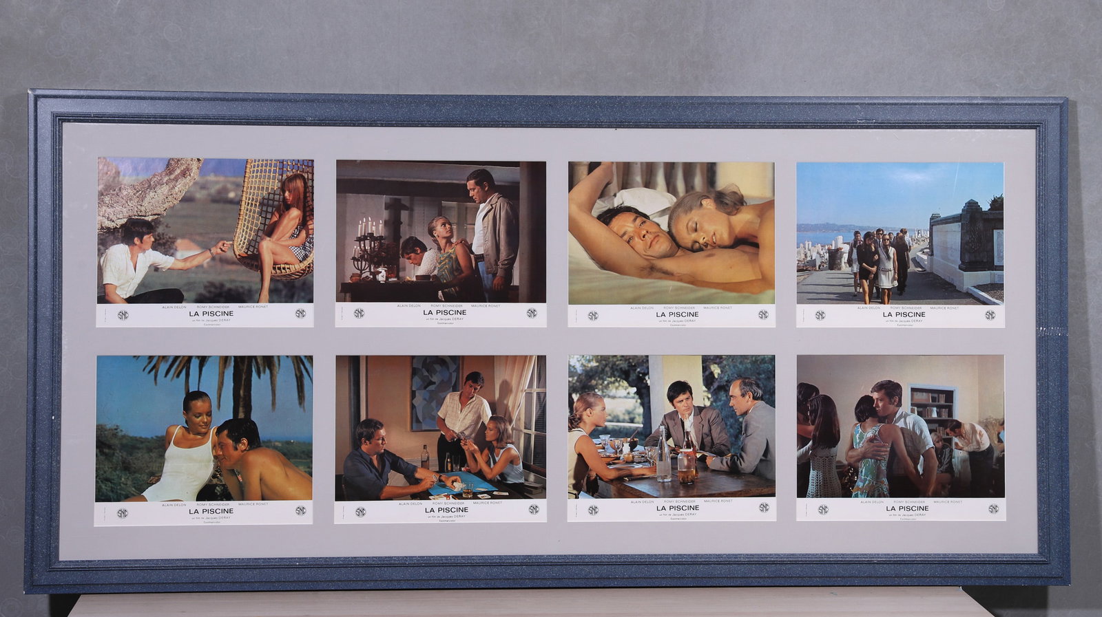 1969 French Lobby Card Set for La Piscine, Framed Limited Edition: Directed by Jacques Deray and starring Alain Delon, Romy Schneider and Maurice Ronet, La Piscine is a landmark of French psychological thriller cinema, set against the sun drenched backdrop of a Cote 