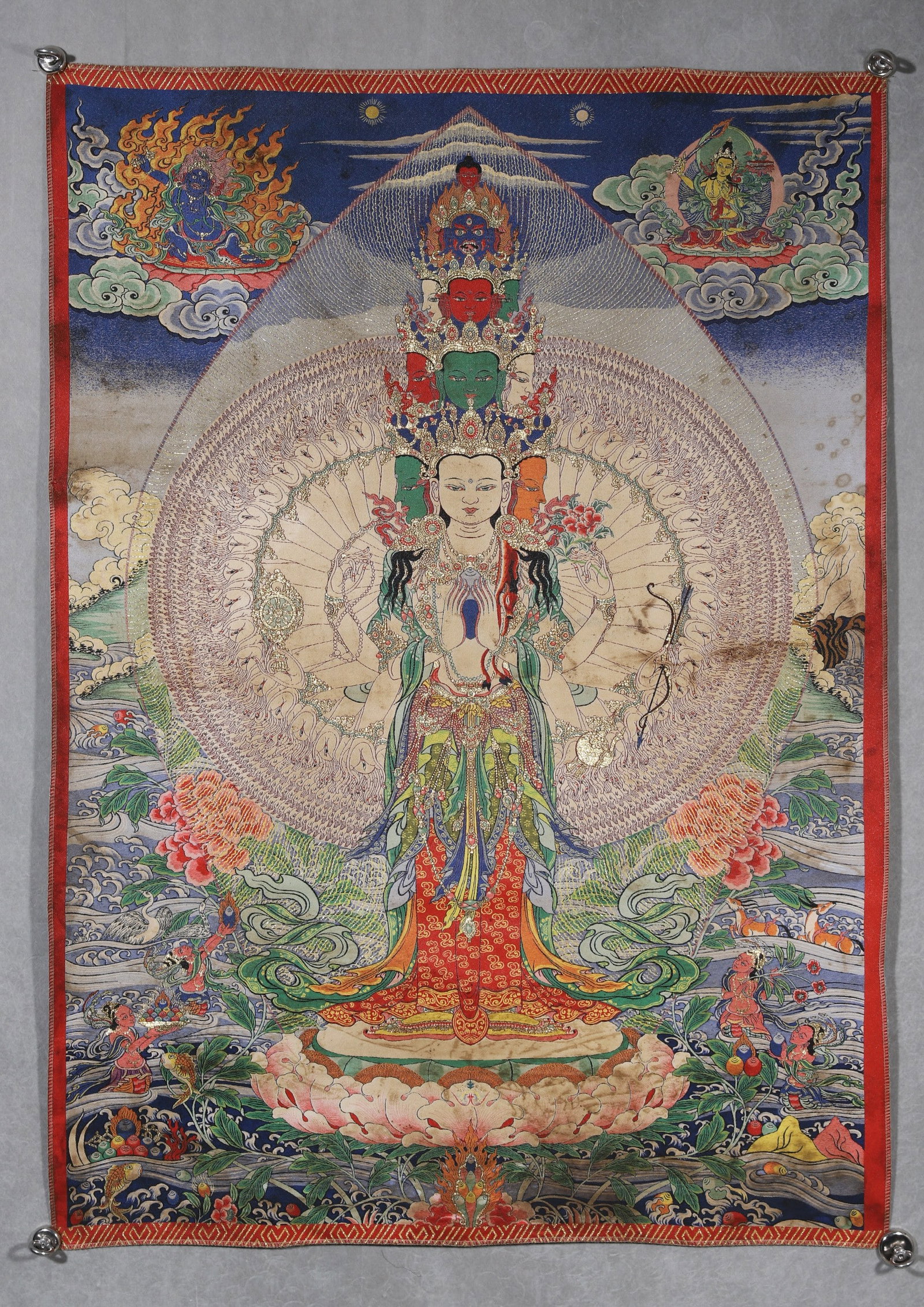 Qing Dynasty, Embroidered Thangka of Thousand-Armed and Thousand-Eyed Avalokiteshvara: A Qing Dynasty embroidered thangka of Thousand-Armed and Thousand-Eyed Avalokiteshvara. Exquisitely crafted with fine embroidery and gold threads, featuring the multi-headed deity with thousand arms a