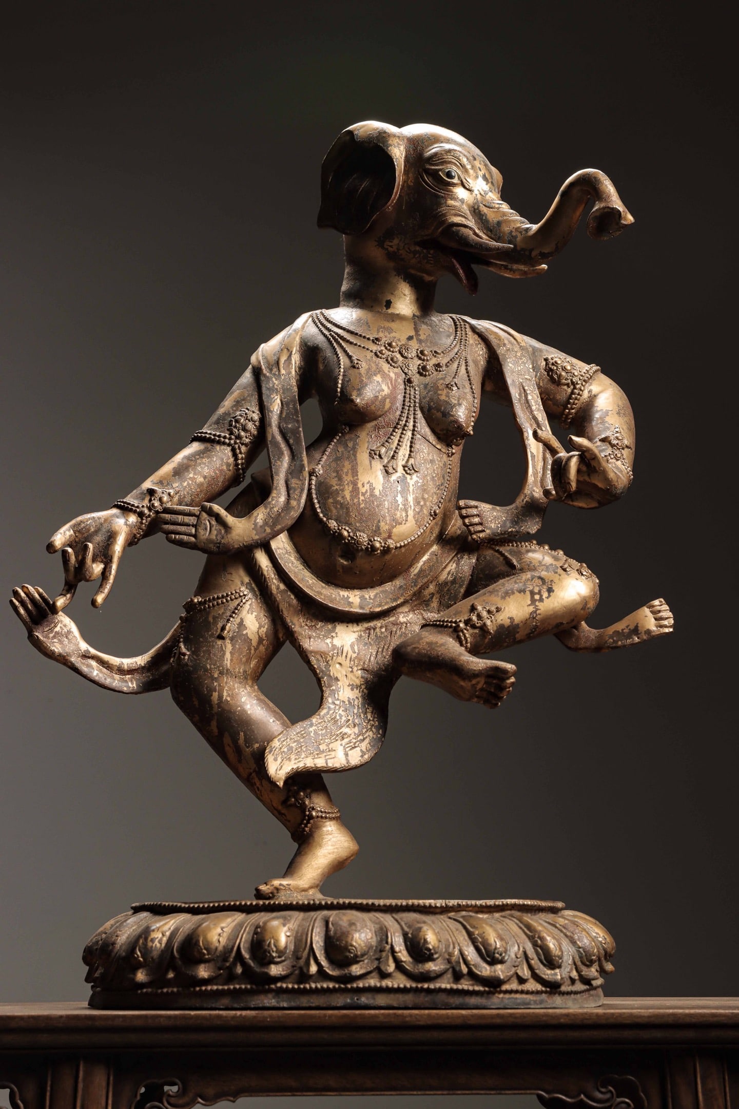 Qing Dynasty, Gilt Bronze Statue of Elephant-Headed Tara: This gilt bronze statue of Elephant-headed Tara was crafted in the Qing Dynasty. It features an elephant head and human body with solemn and vivid demeanor, adorned with delicate inlaid ornaments and 