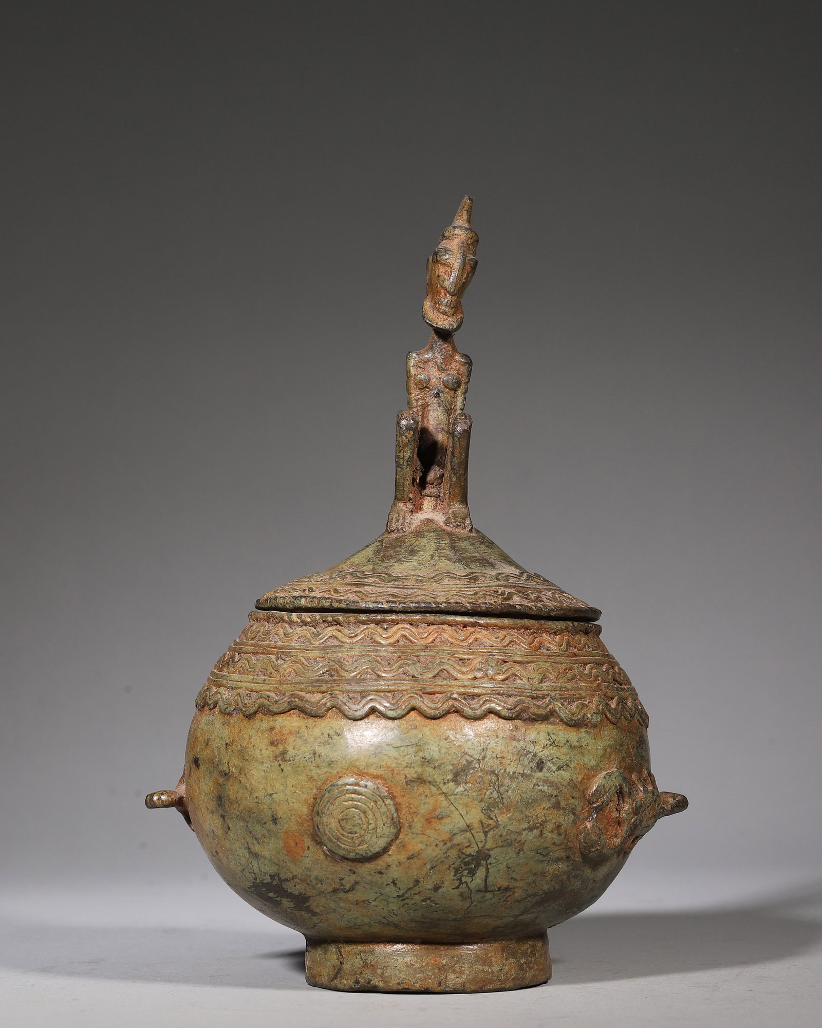 Dogon Brass Storage Vessel 19th Century: Hand-forged brass containers with anthropomorphic finial-lids of the Dogon people of Mali date to the 19th century, for storing ritual herbs, shells and ancestral bone-fragments. Metallic material