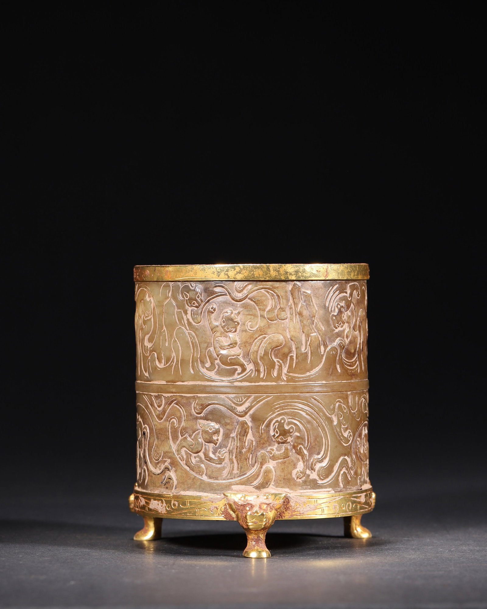Han Dynasty Gilt-Bronze and Jade Inlaid 'Lian' with Divine Beast Motifs: An exquisite Han Dynasty aristocratic vessel, featuring a gilt-bronze base and jade body adorned with dynamic divine beast motifs. It exemplifies the pinnacle of Han Dynasty gold and jade craftsmanshi