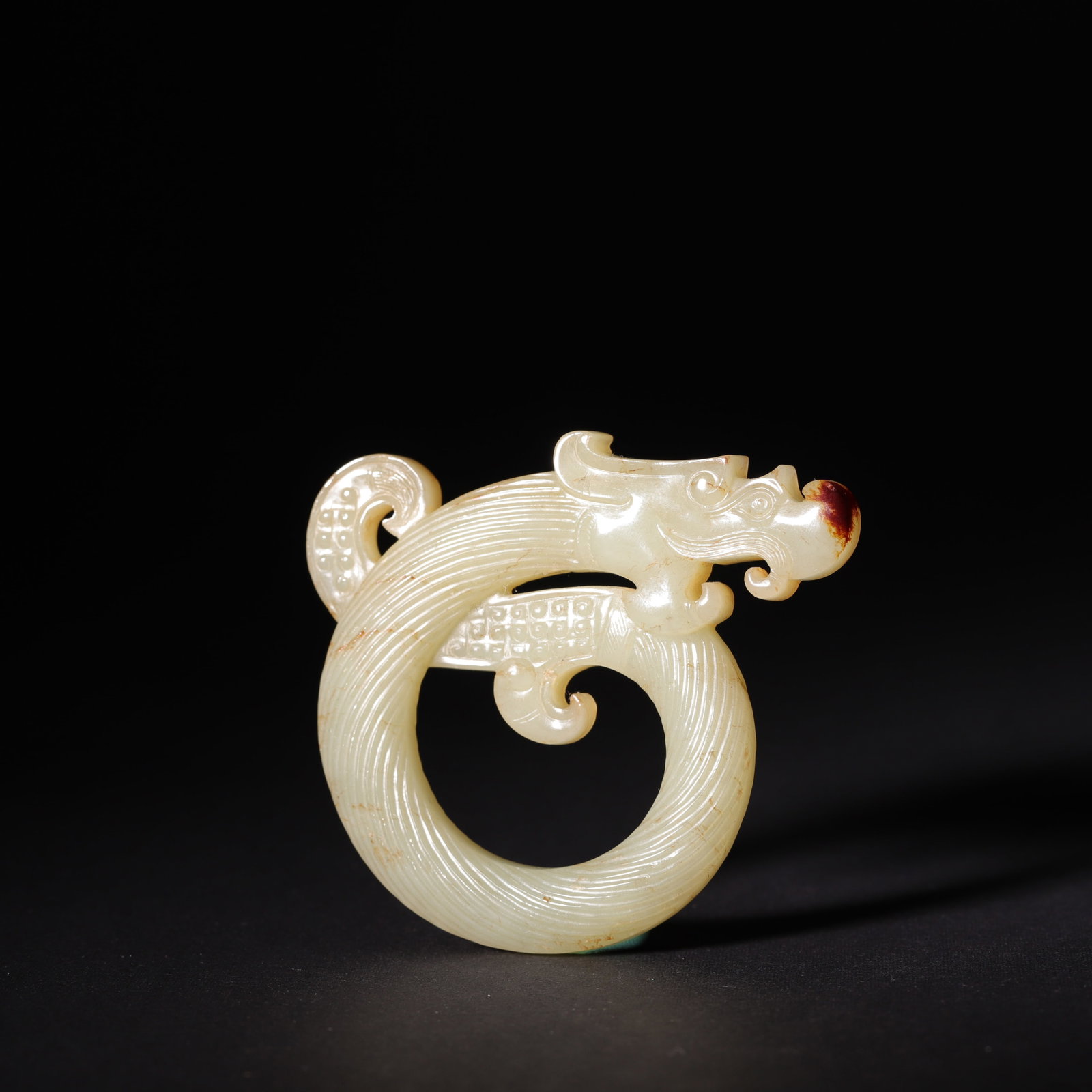 A Warring States White Hetian Jade C-Shaped Dragon Pendant with Twisted Cord Grain (1 of 7)