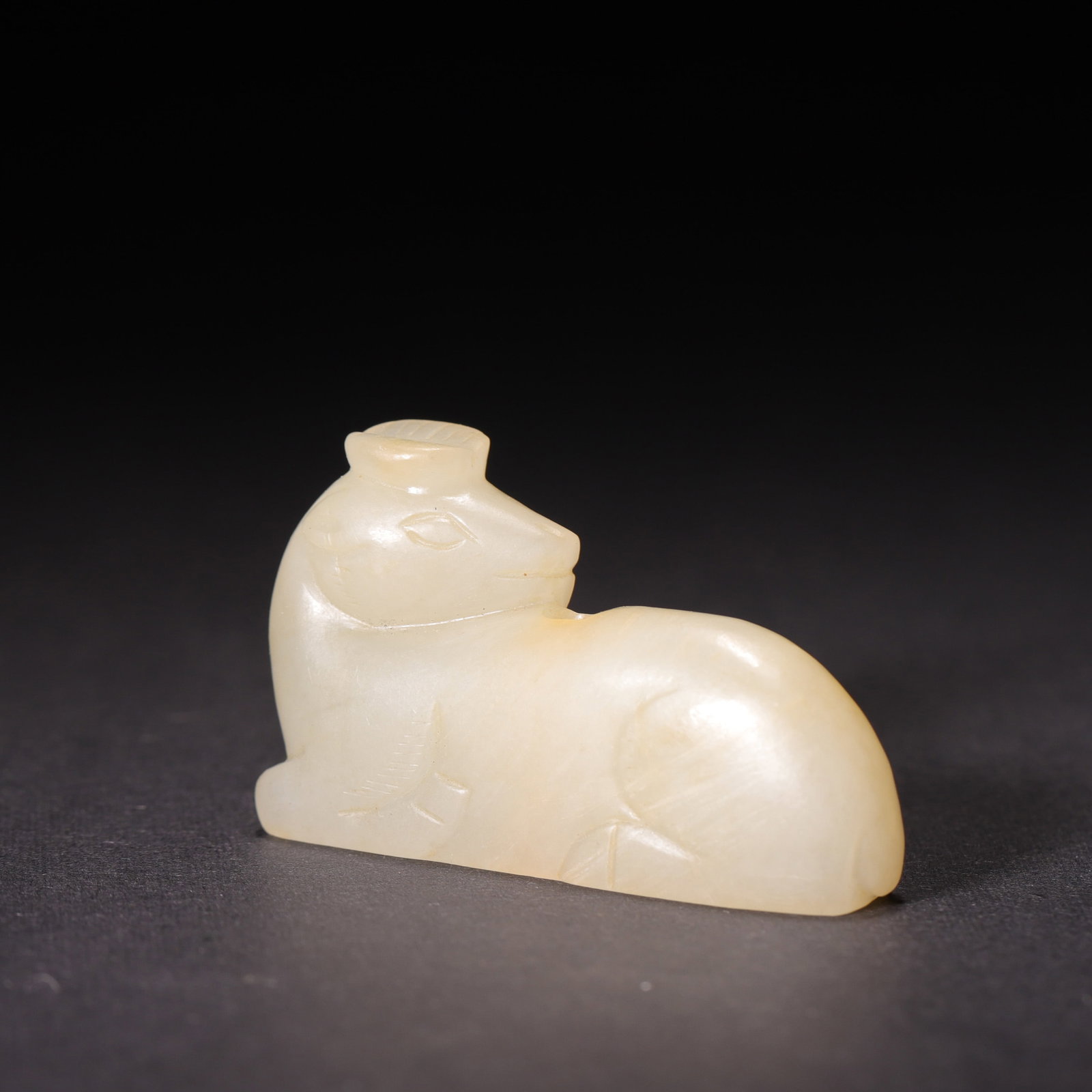 A Han Dynasty White Hetian Jade Recumbent Deer Pendant (1 of 7)