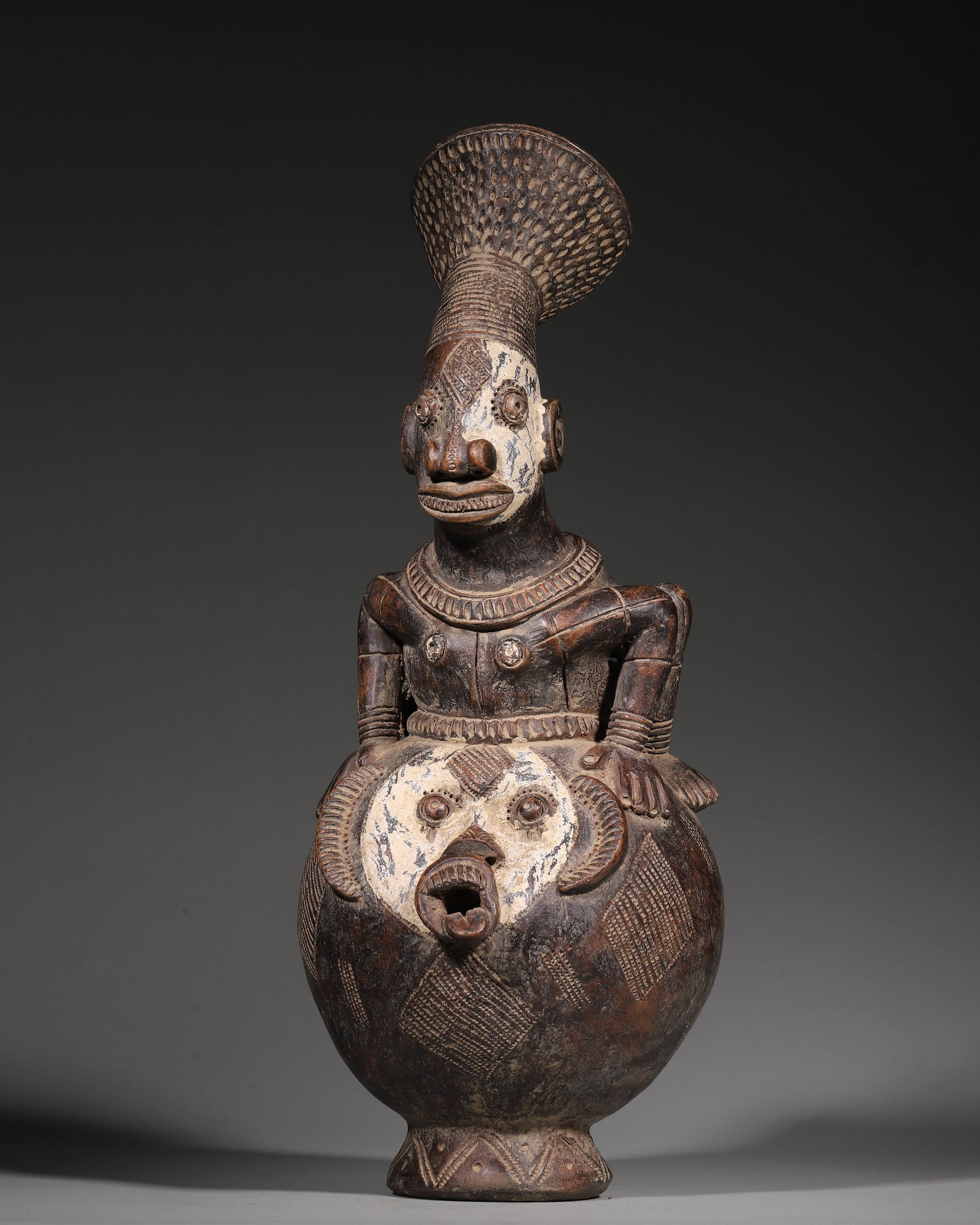 Terracotta Libation Vessel 18th Century: Hand-modeled terracotta artefacts of the Ashanti people of Ghana date to the 18th century. Used to pour palm-wine libations to ancestors during large-scale clan ceremonies and at communal feasts,