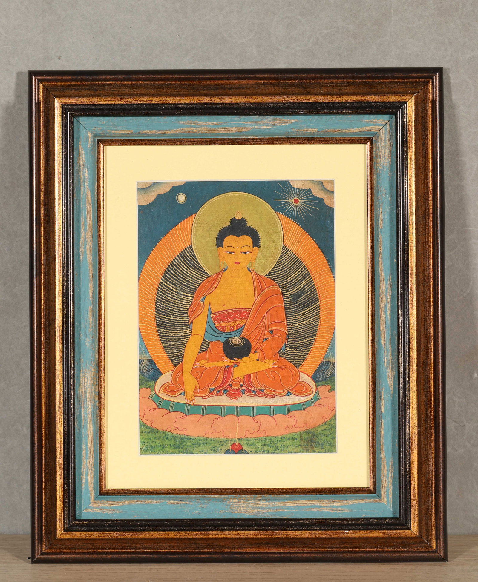 Framed Thangka of Sakyamuni Buddha, Qing Dynasty (1636-1912): Thangka depicts Sakyamuni Buddha seated in lotus position with solemn appearance. The halo has layered patterns, rich and stable colors, presented in original frame. Dimensions: Length: 32cm