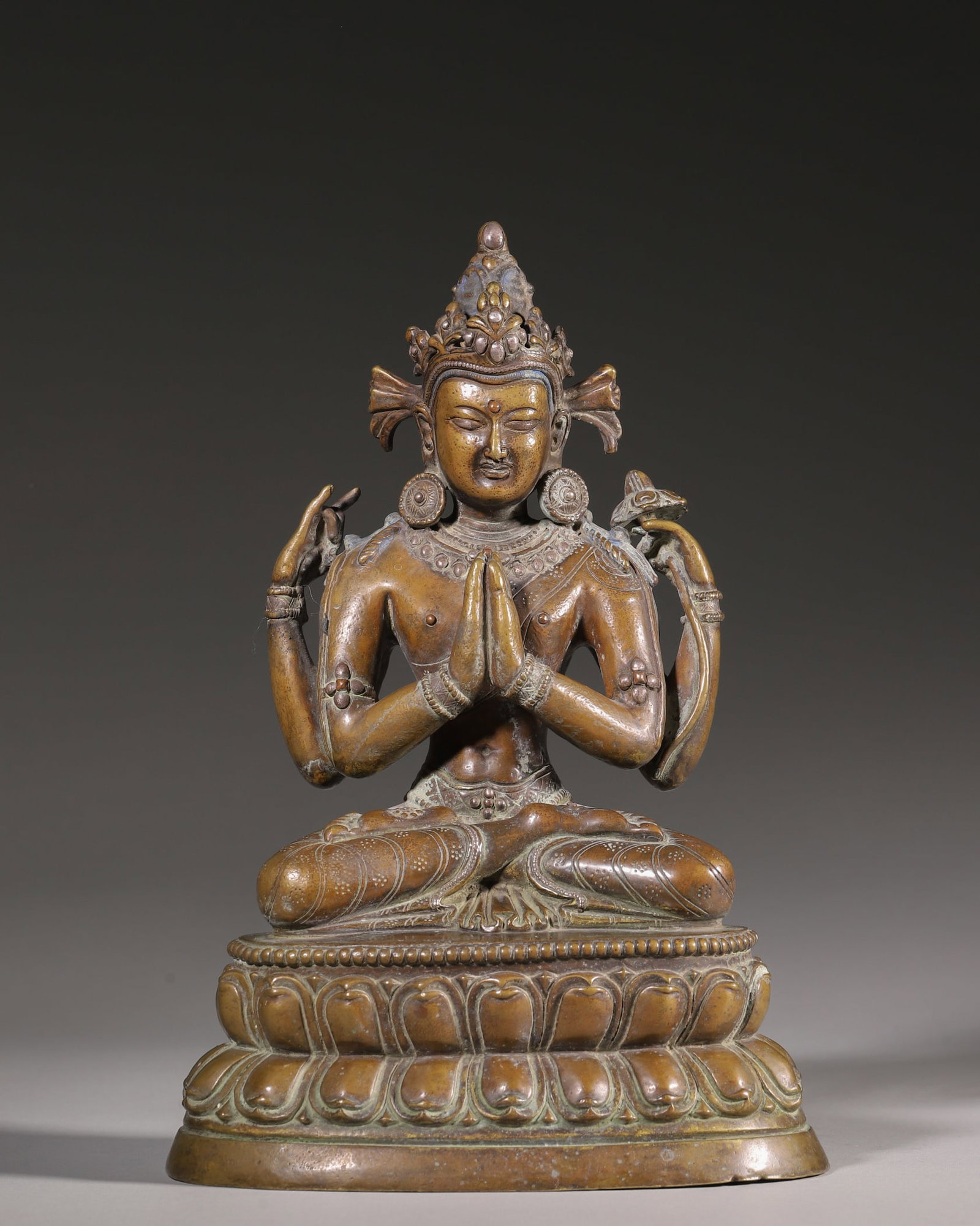 Qing Dynasty, Bronze Statue of Four-Armed Avalokiteshvara: This is a bronze statue of Four-Armed Avalokiteshvara from the Qing Dynasty, cast in fine copper with mellow patina. The deity sits on a double lotus pedestal with hands in prayer, holding a rosary an