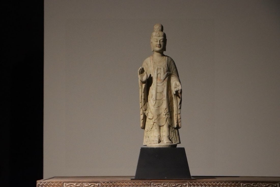 Northern Wei Dynasty, Fine White Marble Standing Bodhisattva: Exquisitely carved with a serene and compassionate face, this figure is clad in a flowing robe draped over both shoulders and stands atop a lotus pedestal. The piece is in excellent overall condition,