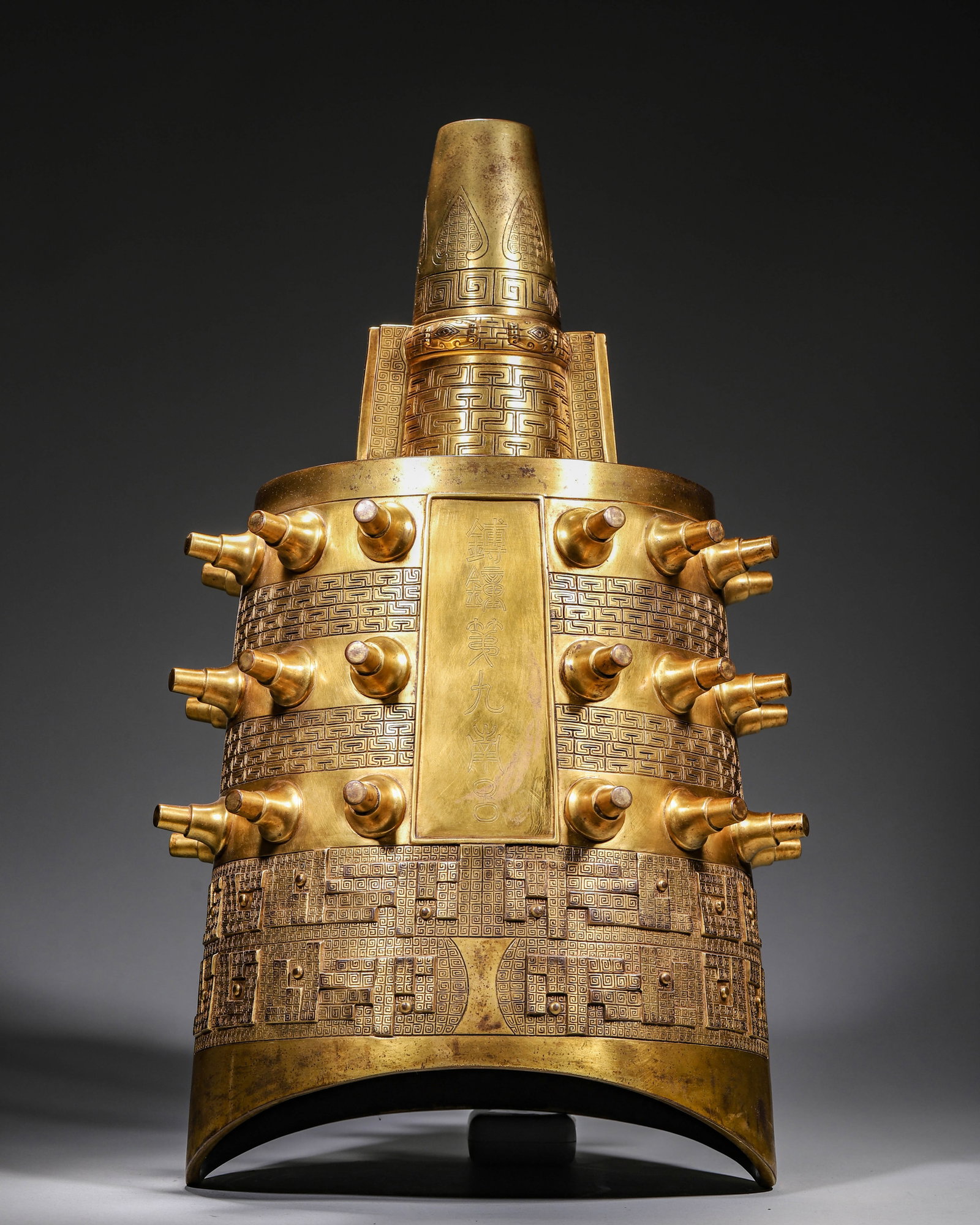 Qing Dynasty, Qianlong Period, Imperial Gilt Bronze Bo Bell: This gilt bronze bo bell was an imperial ritual instrument of the Qianlong Qing court. Fully gilded fine bronze with intact golden patina, it adopts ancient bell shape carved with spiral, leaf and bea