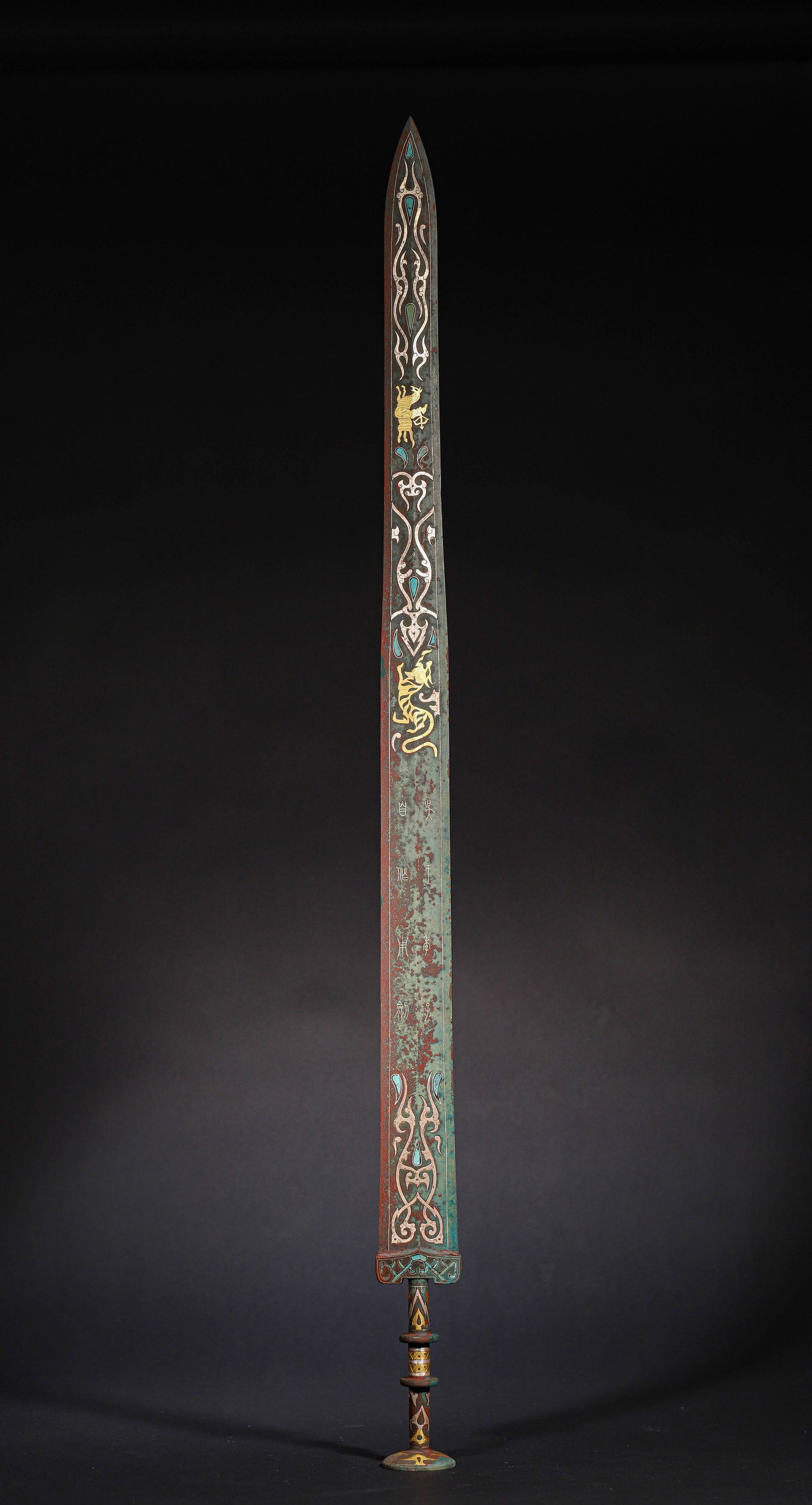 Warring States Bronze Sword with Gold-Silver Inlay and Turquoise Dragon-Phoenix Motifs: A rare Warring States bronze sword: exquisite gold-silver inlay & turquoise, dynamic dragon-phoenix motifs, neat inscriptions. Merging Warring States weapon craft peak & decorative art??a rare pre-Qin