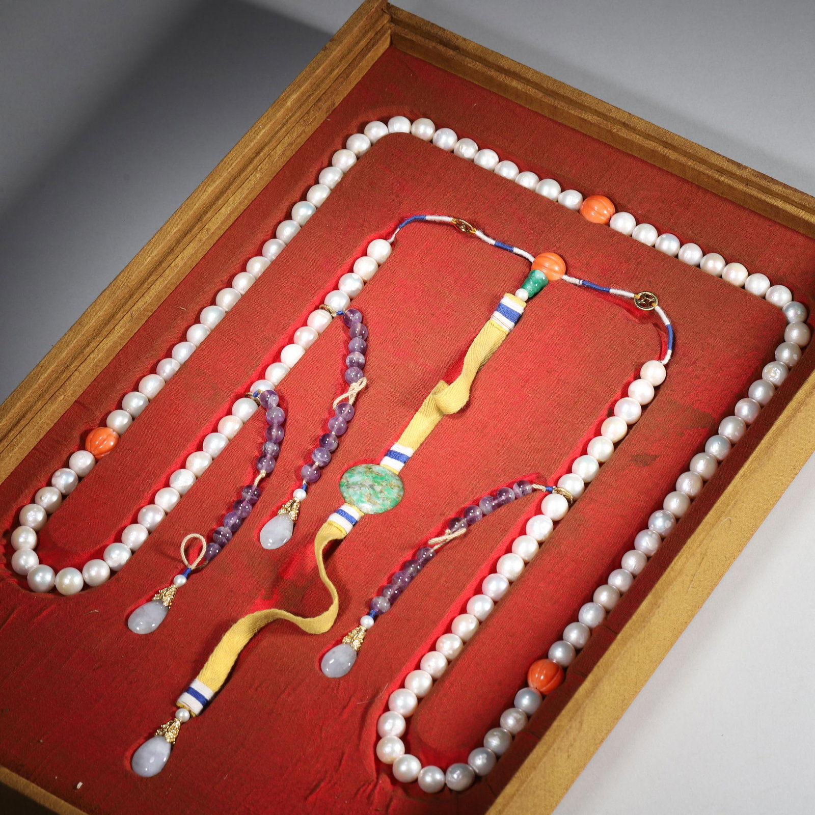 Pearl Court Necklace, Qing Dynasty, 1636-1912: Court necklace strung with pearl beads,adorned with multi-color spacers,back pendant and drops,housed in original silk brocade box for court ceremony. Dimensions: Diameter: 1.1cm (0.43in), Weight: 328