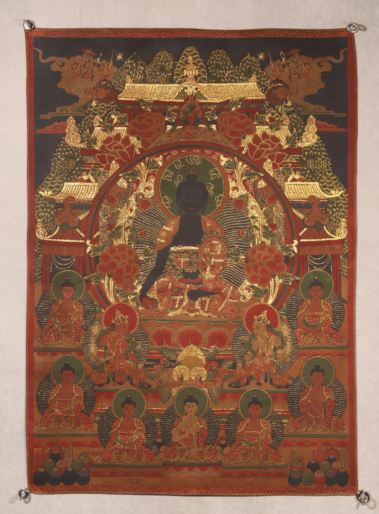 Qing Dynasty, Embroidered Black-and-Gold Thangka of Bhaisajyaguru Buddha: A Qing Dynasty embroidered black-and-gold thangka of Bhaisajyaguru Buddha, seated on a lotus throne. Meticulously crafted with fine embroidery and gold threads, featuring solemn figures and auspicious