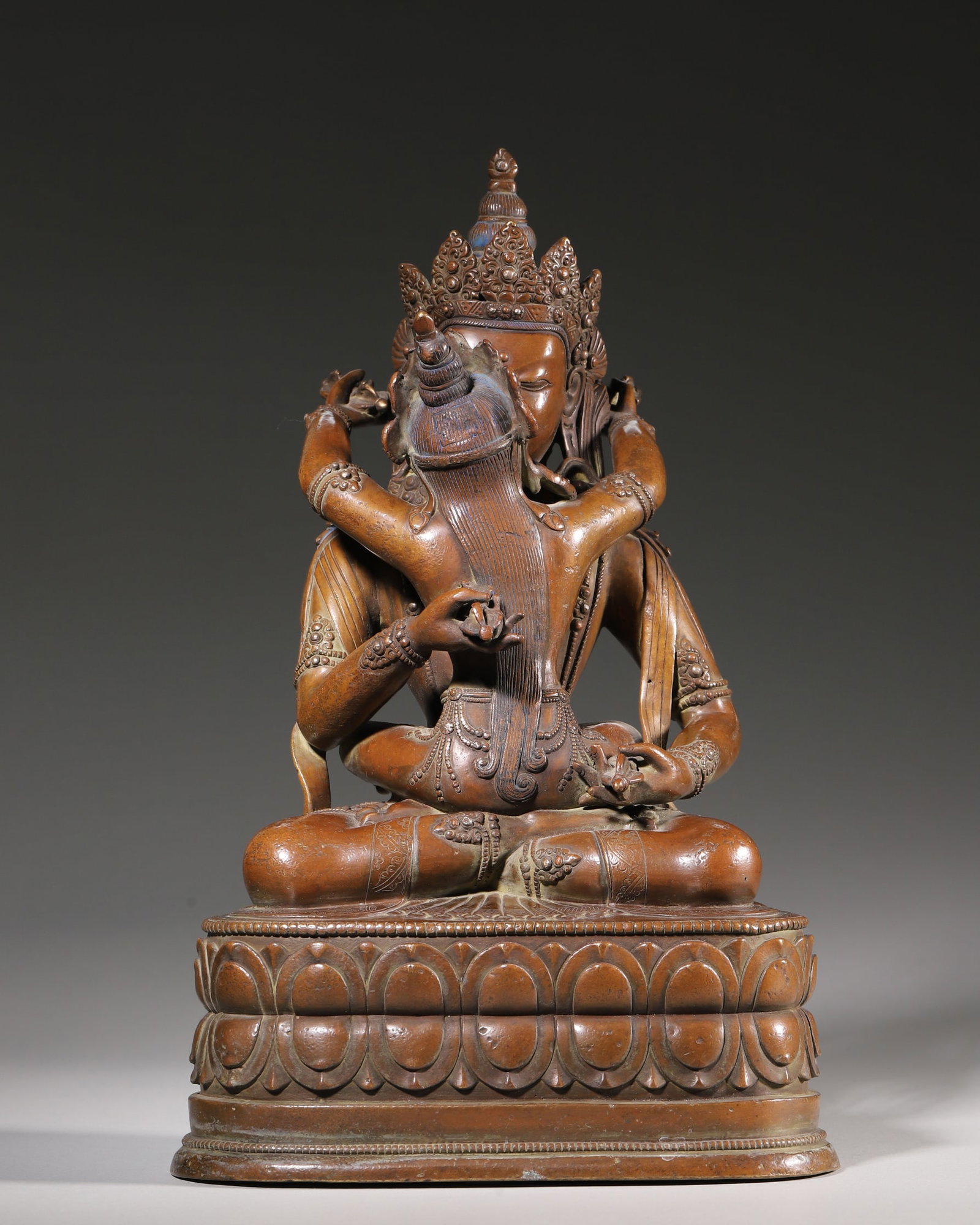 Qing Dynasty, Bronze Statue of Vajradhara in Yab-Yum: This is a bronze statue of Vajradhara in Yab-Yum from the Qing Dynasty, cast in fine copper with mellow patina. The main deity sits on a double lotus pedestal with the consort, holding a vajra and a b
