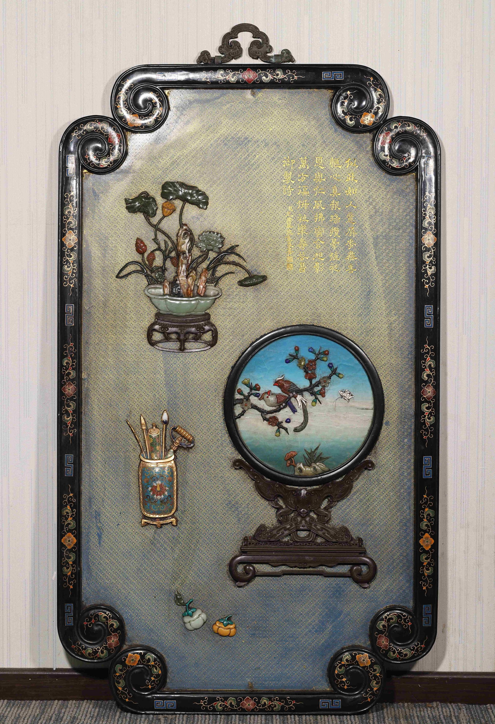 Qing Dynasty, Qianlong Period, Black Lacquer Screen with Imperial Poem and "Antiques" Inlay: This imperial hanging screen, made during the Qianlong period, features a black lacquer ground with gilded key fret pattern, inlaid with precious stones in antiques and flower and bird motifs, and acc