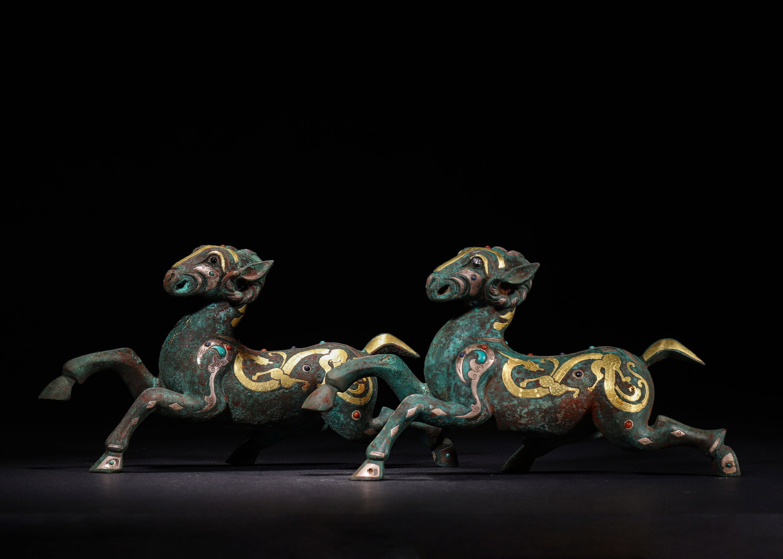 Han Dynasty, Gold, Silver, and Gemstone Inlaid Bronze Galloping Ram Weights, Pair (1 of 12)